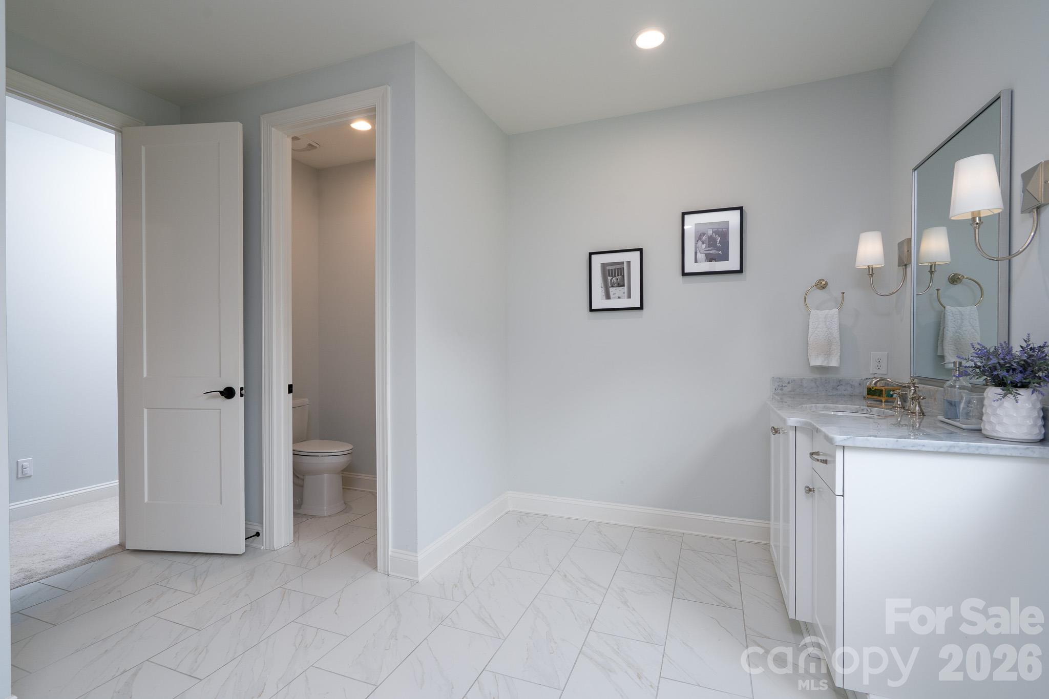 Private restroom off Primary bath. - 9588 Pacing Lane NW, Concord