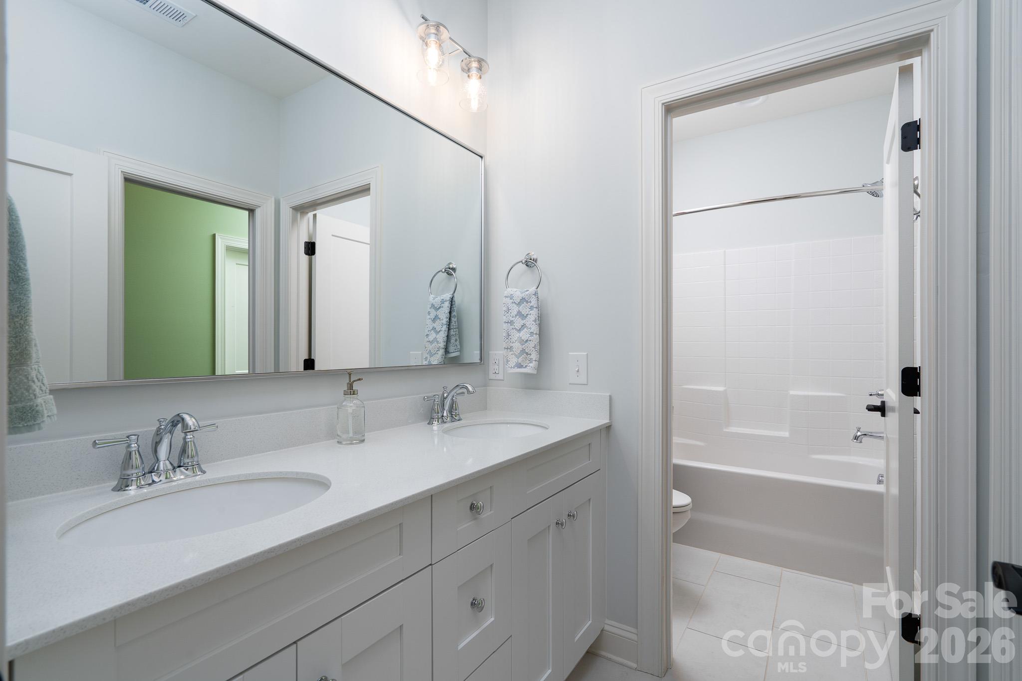 Second floor Hall Bathroom with private restroom and Tub/Shower. Largest Bedroom has private access - 9588 Pacing Lane NW, Concord