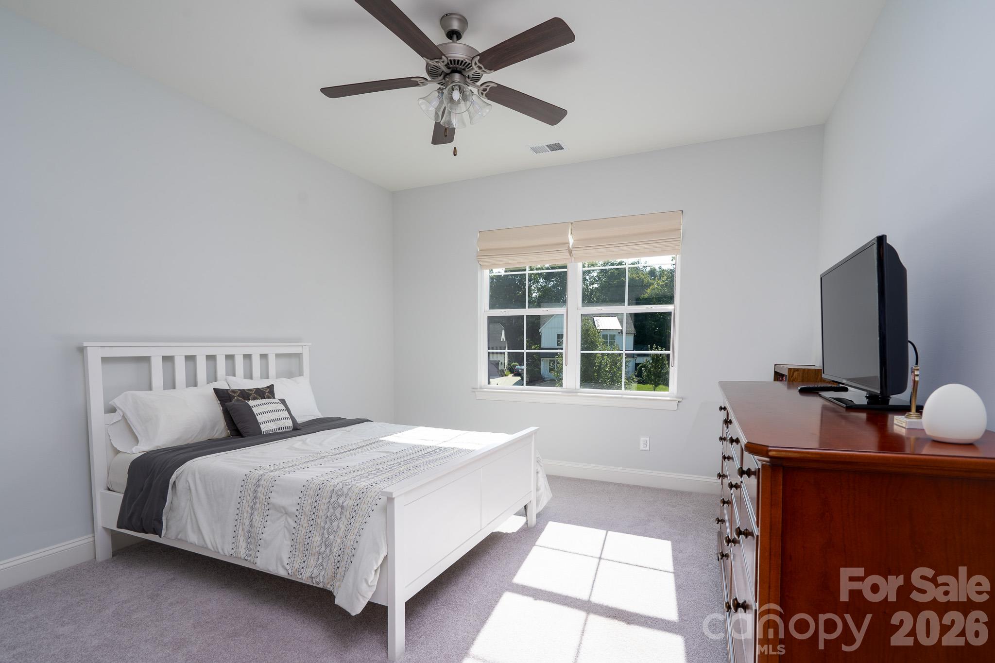 Bright guest Bedroom facing the green space - 9588 Pacing Lane NW, Concord