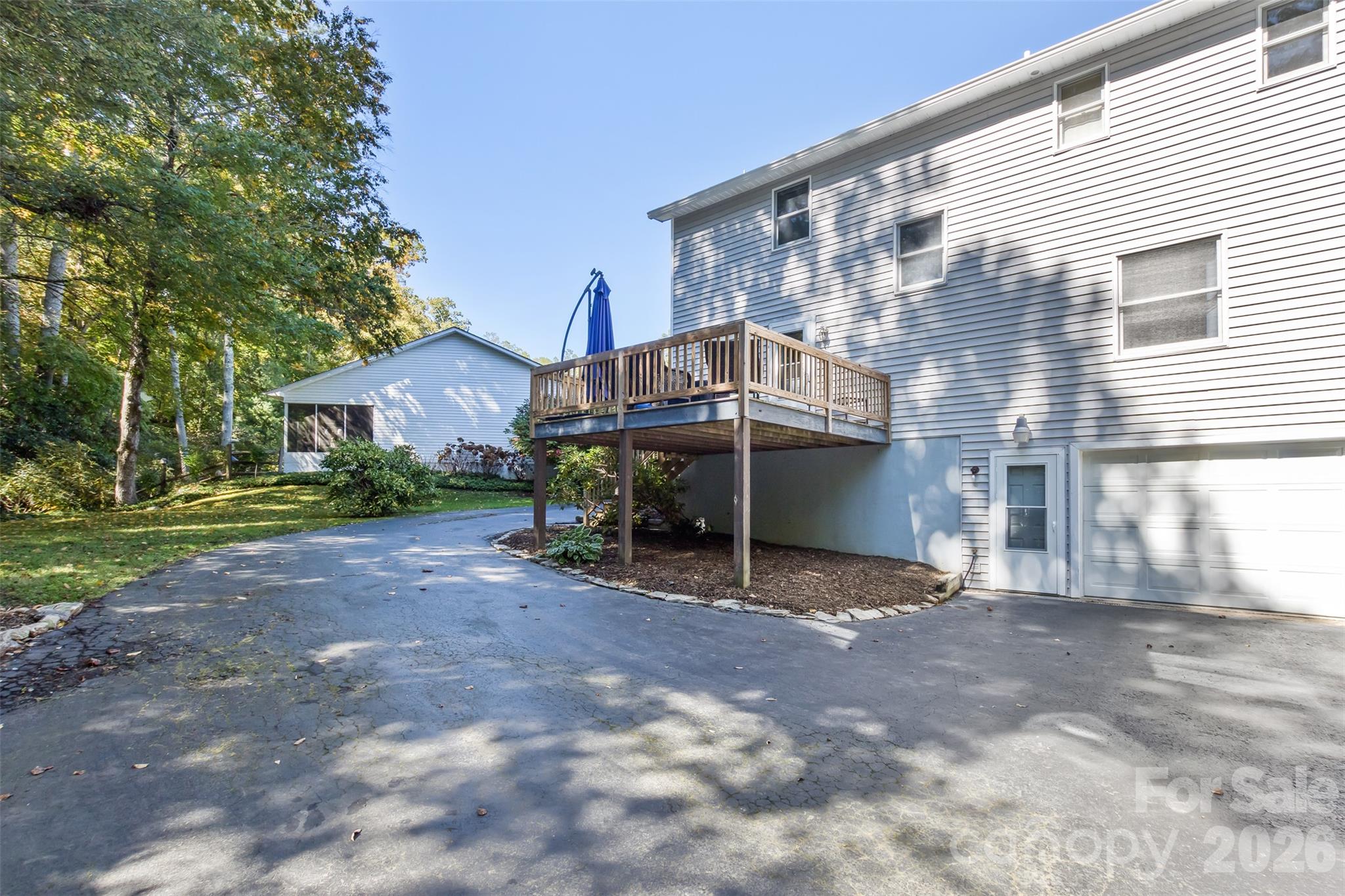 Back of Home, with large deck and garage entrance. - 2911 Middleton Place, Hendersonville