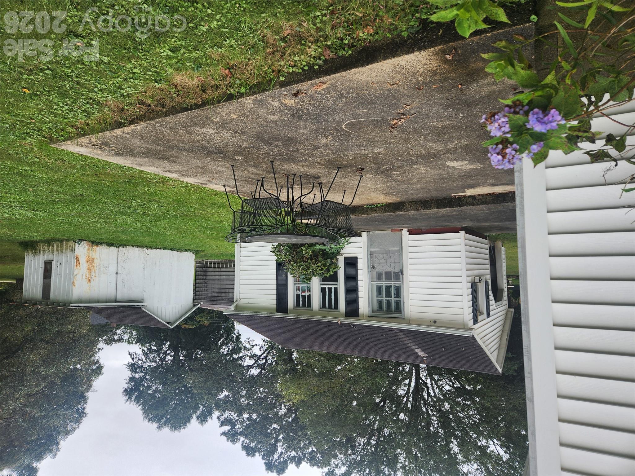 Patio and Laundry/Work Room. Also shows Outbuilding that will stay. - 1327 21st Street Street NE, Hickory