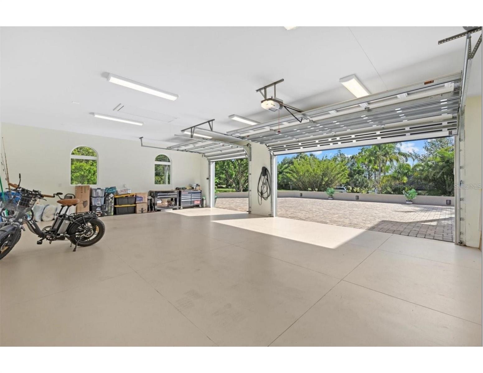 3 Car garage facing South - 2115 LYCHEE LN, NOKOMIS