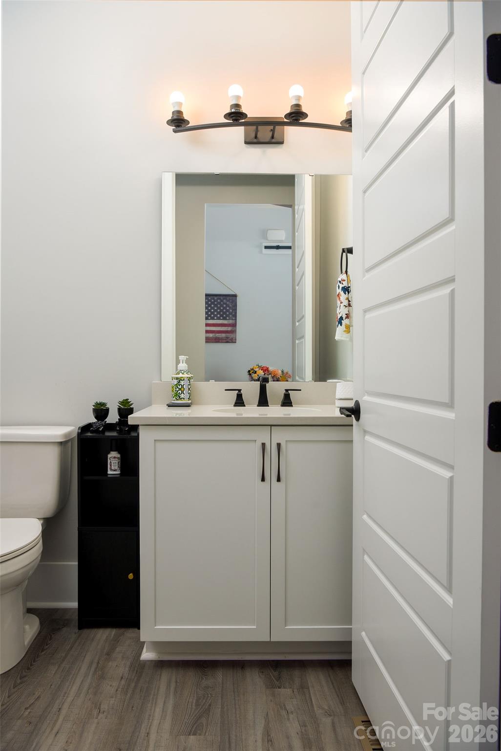 Half bath conveniently located in the hallway - 295 Rhode Island Court, Mocksville