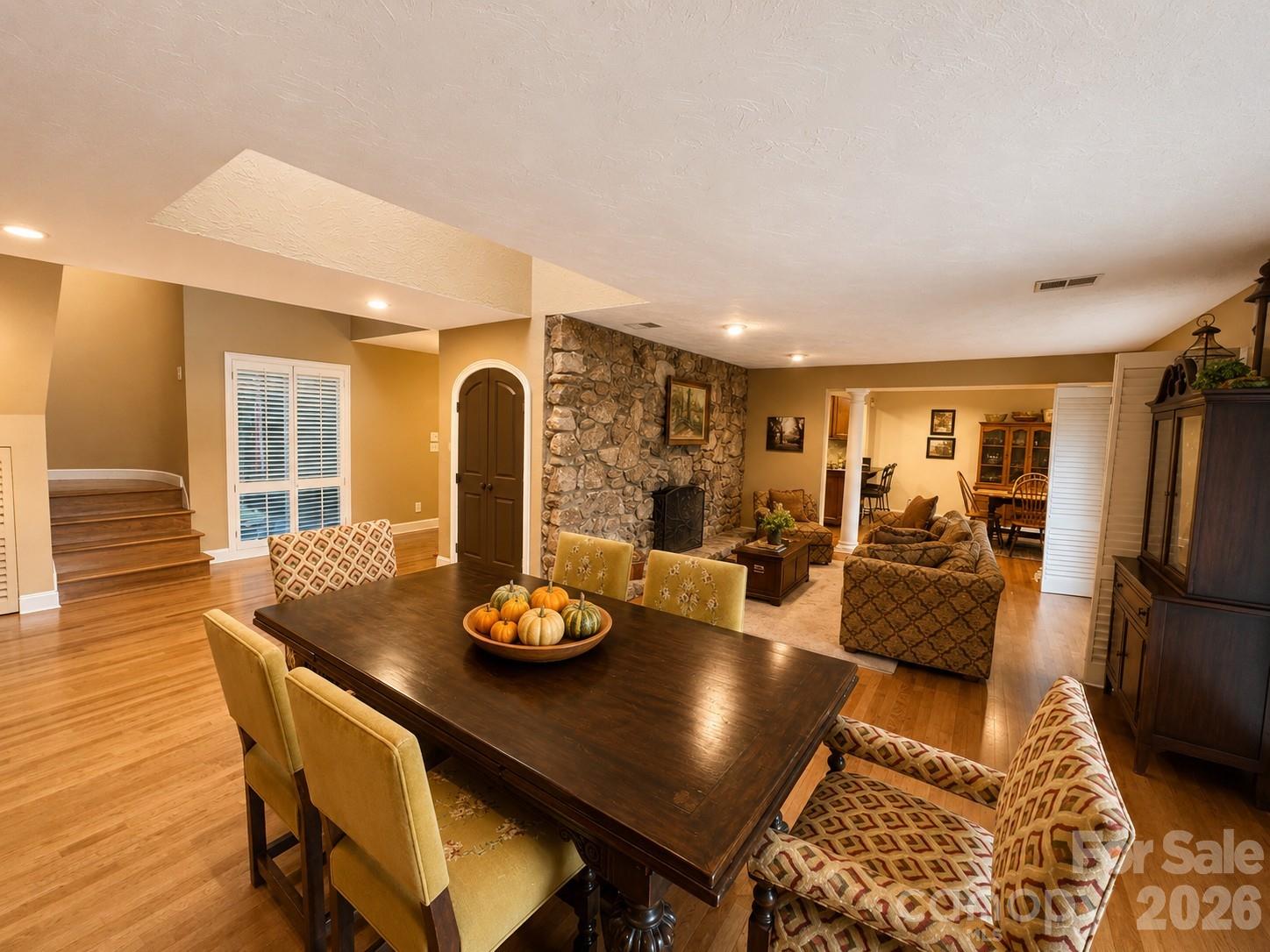 Entertaining is easy in this house with 2 bars, open concept dining, breakfast area and living room, huge den and access to the wrap around deck looking out to the golf course. The pool area is another fantastic entertainment area. - 4821 Elmhurst Drive NE, Hickory