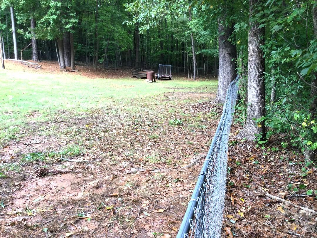 Right side back fence is approx 130 feet long - 911 Freedom Mill None, Gastonia