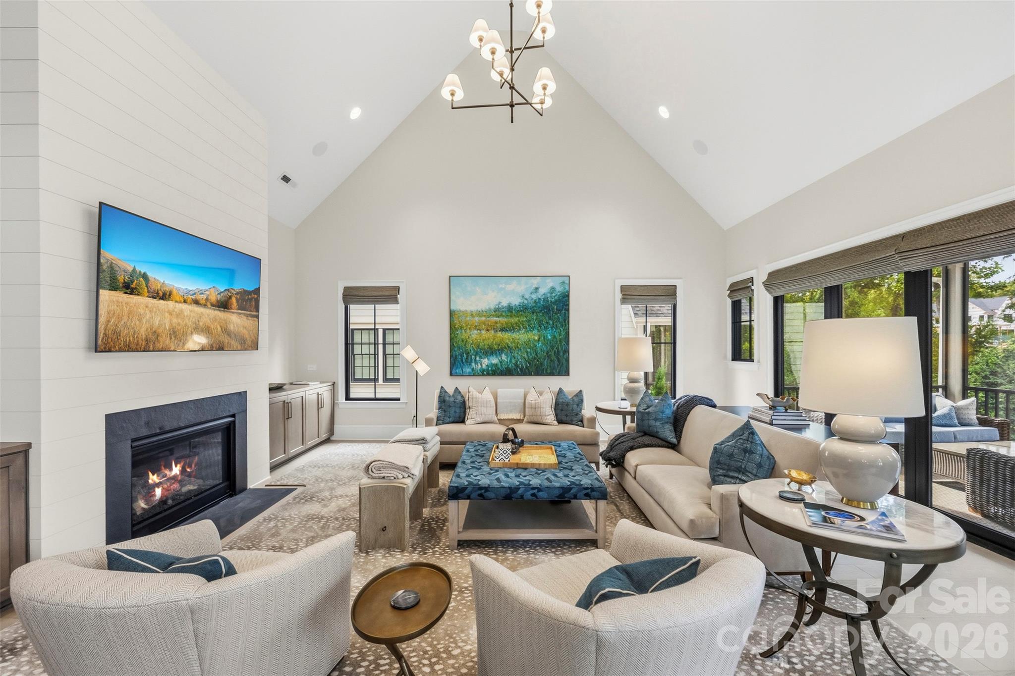 Spacious family room w/accordion style slider doors to the screened porch. - 6222 Louis Patrick Lane, Charlotte
