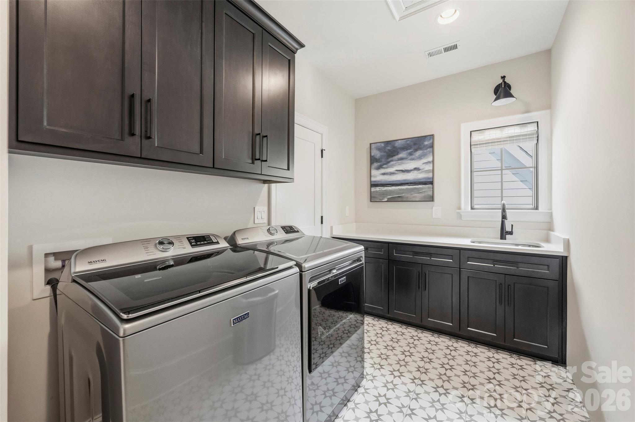 Laundry with entry through primary closet or hallway. - 6222 Louis Patrick Lane, Charlotte