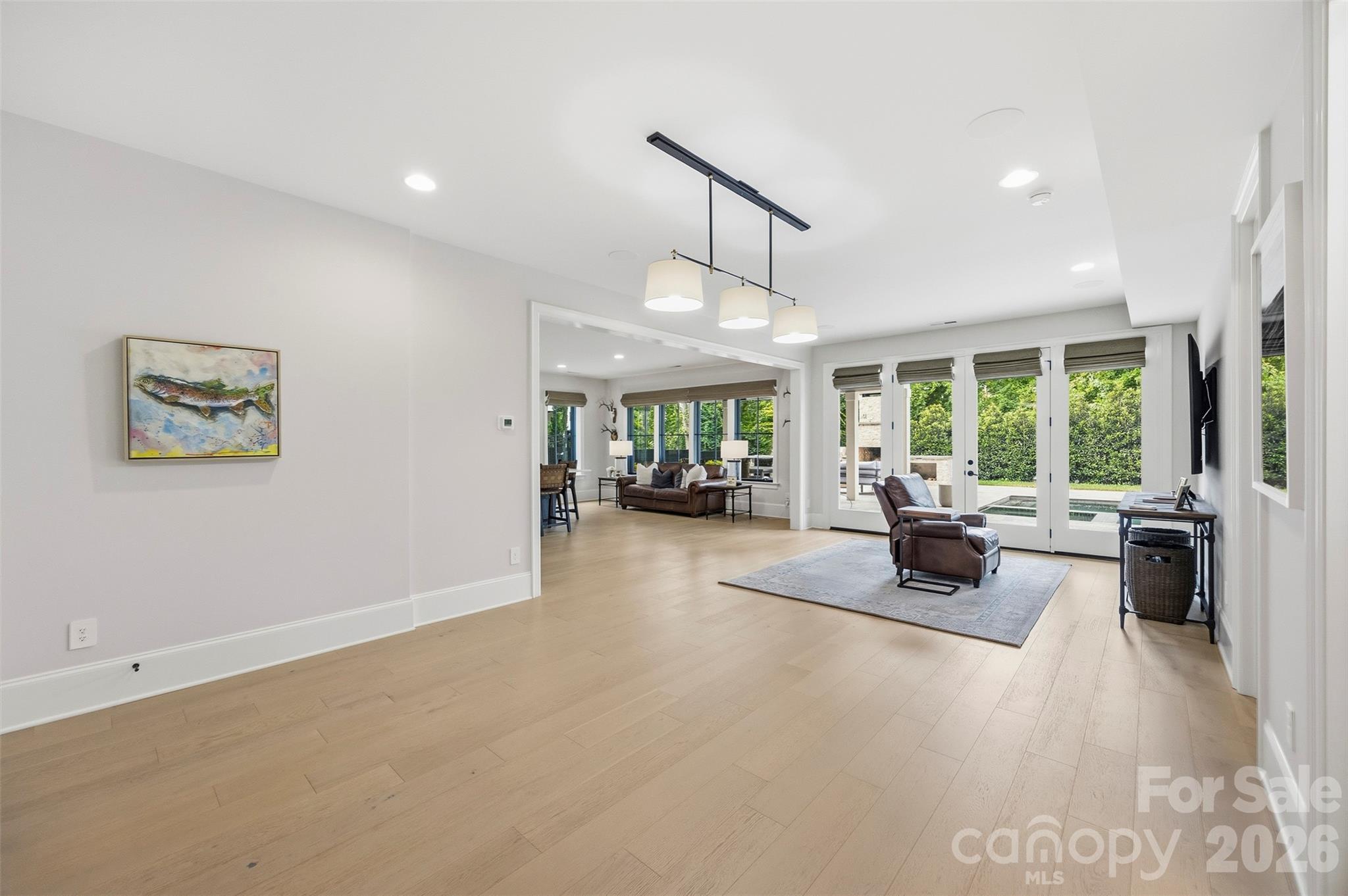 Recreation room open to living and mini-kitchen on lower level - 6222 Louis Patrick Lane, Charlotte
