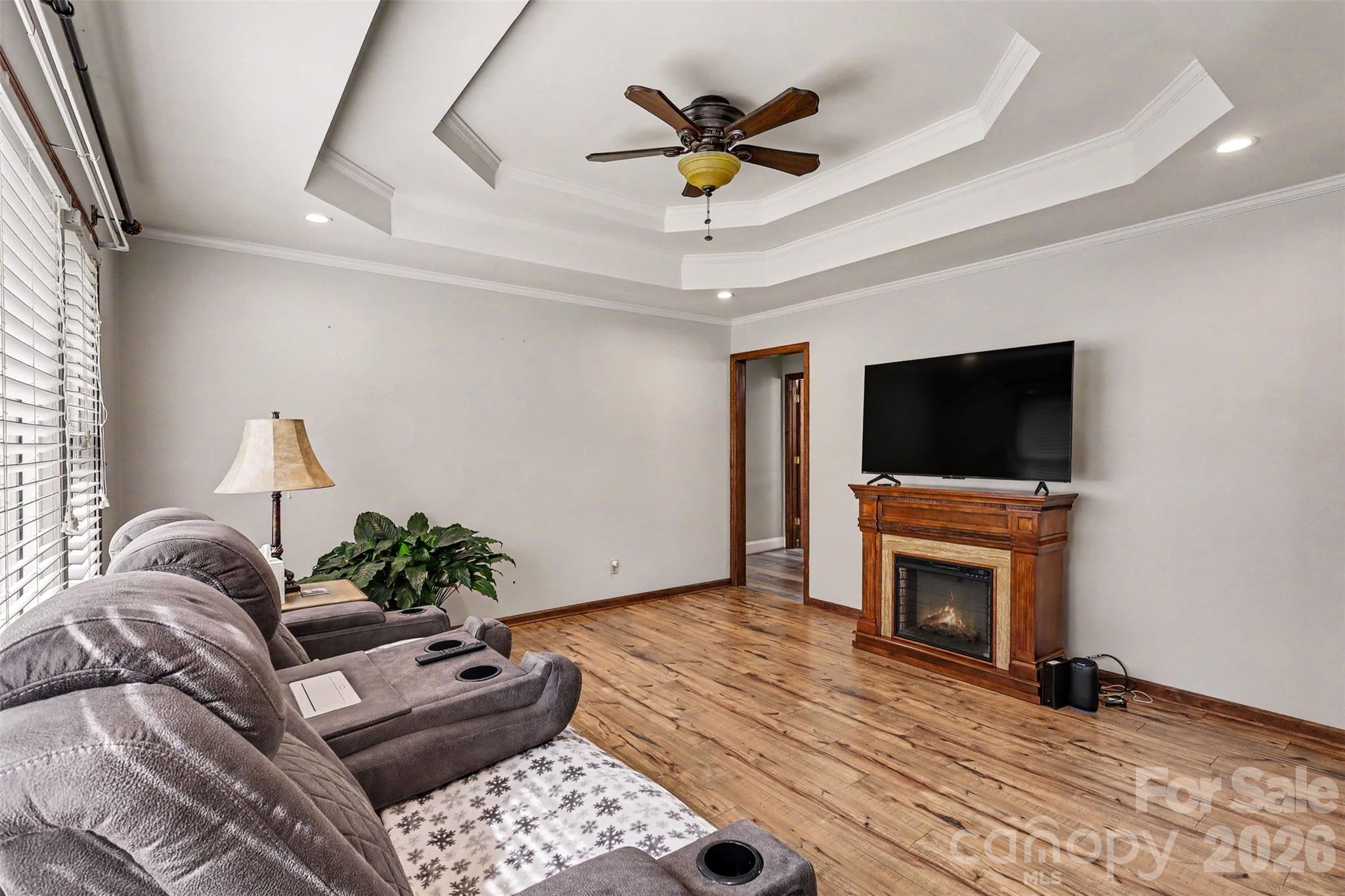 Living Room with Tray Ceiling and updated floors - 9202 Elgin Drive, Charlotte