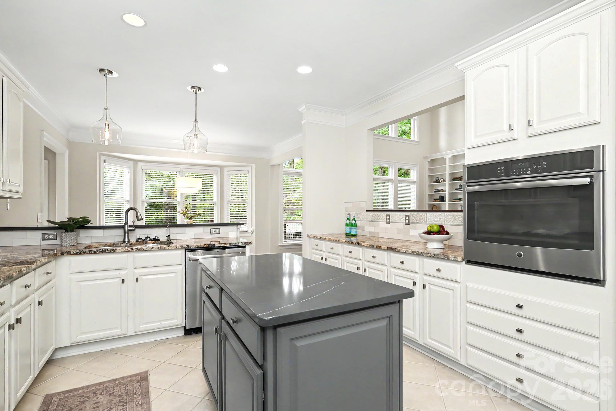 Lovely kitchen with updated lighting, stainless appliances and modern finishes - 4320 Town And Country Drive, Charlotte