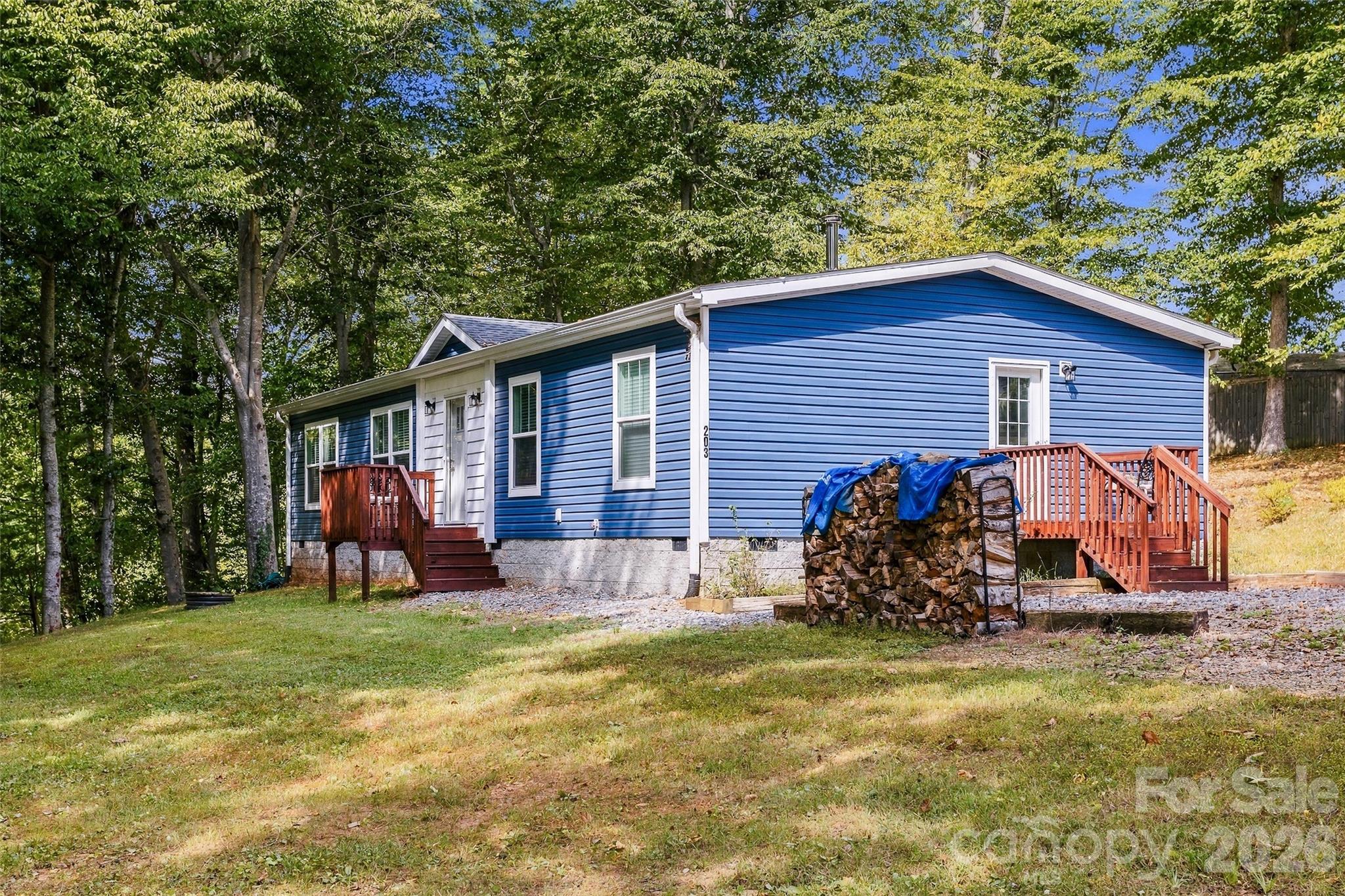Single Family Residence at 203 Beaverdam Loop Road, Candler, photo 6 of 47