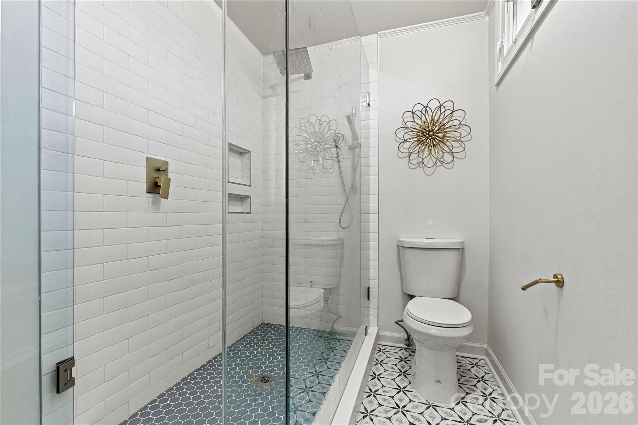 Large tiled showed in the primary bath - 3995 Burton Lane, Denver