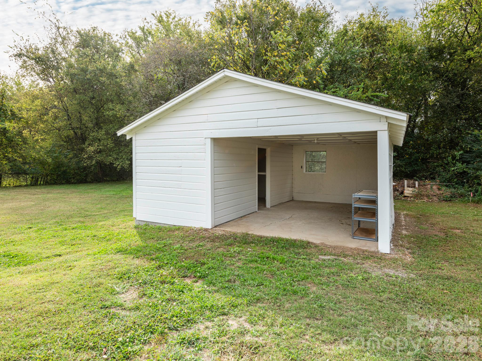 garage with utility/storage room - 4305 Weddington Road, Concord