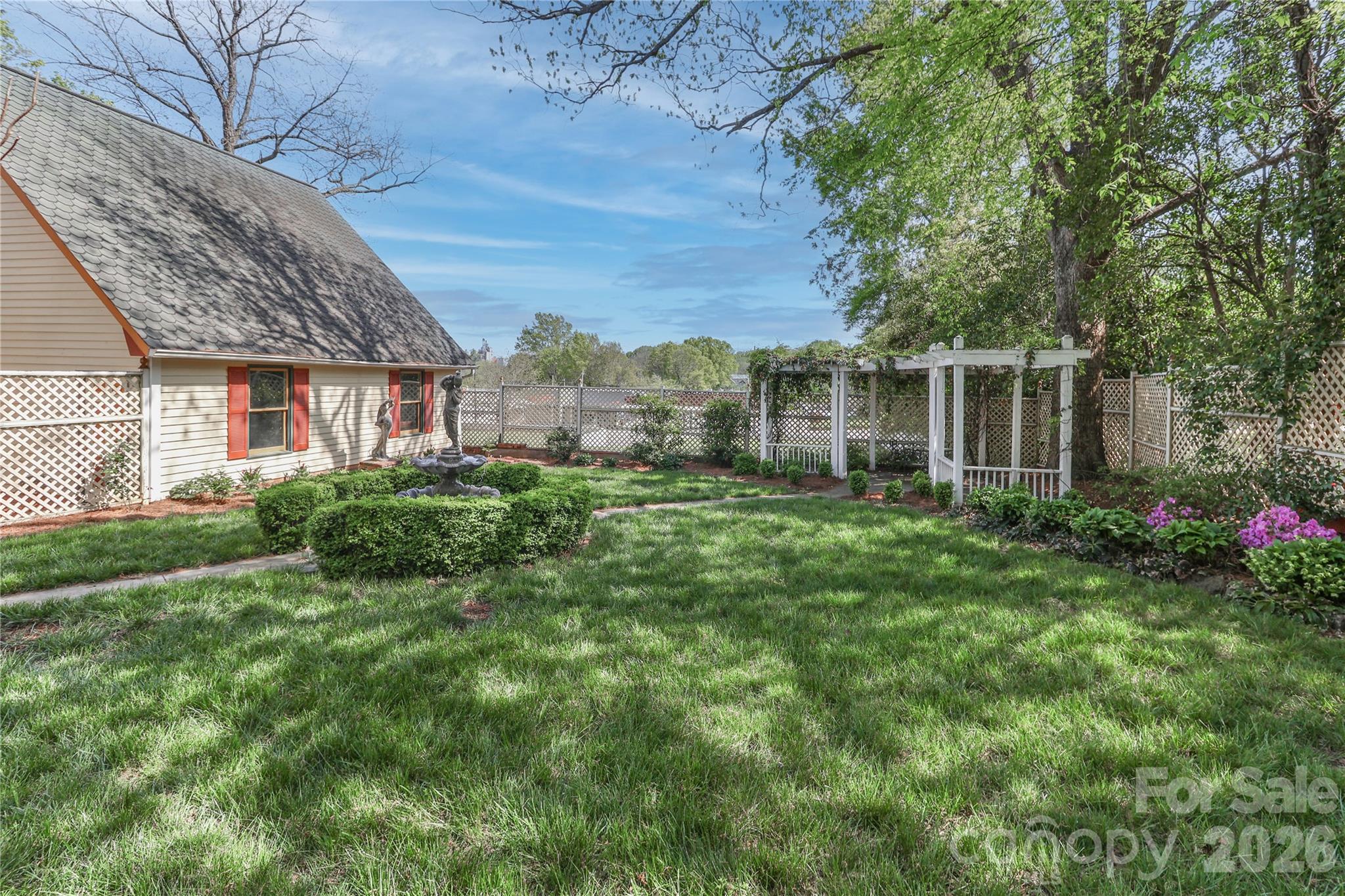 Arbor in the backyard with sitting area. - 235 Walnut Street, Statesville