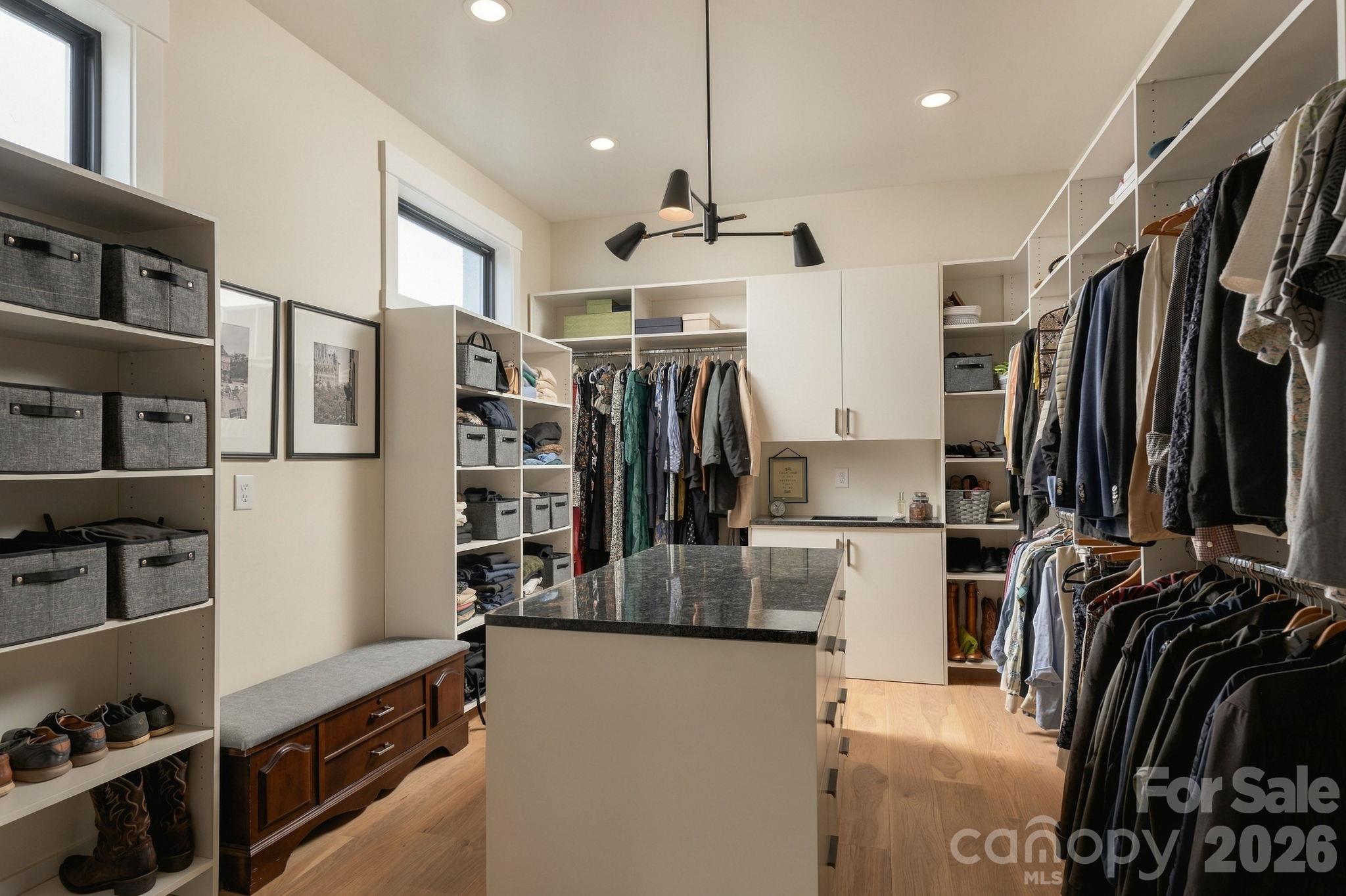 Primary Bedroom Closet with extensive built ins and pass through for laundry - 298 Marietta Road, Mooresville