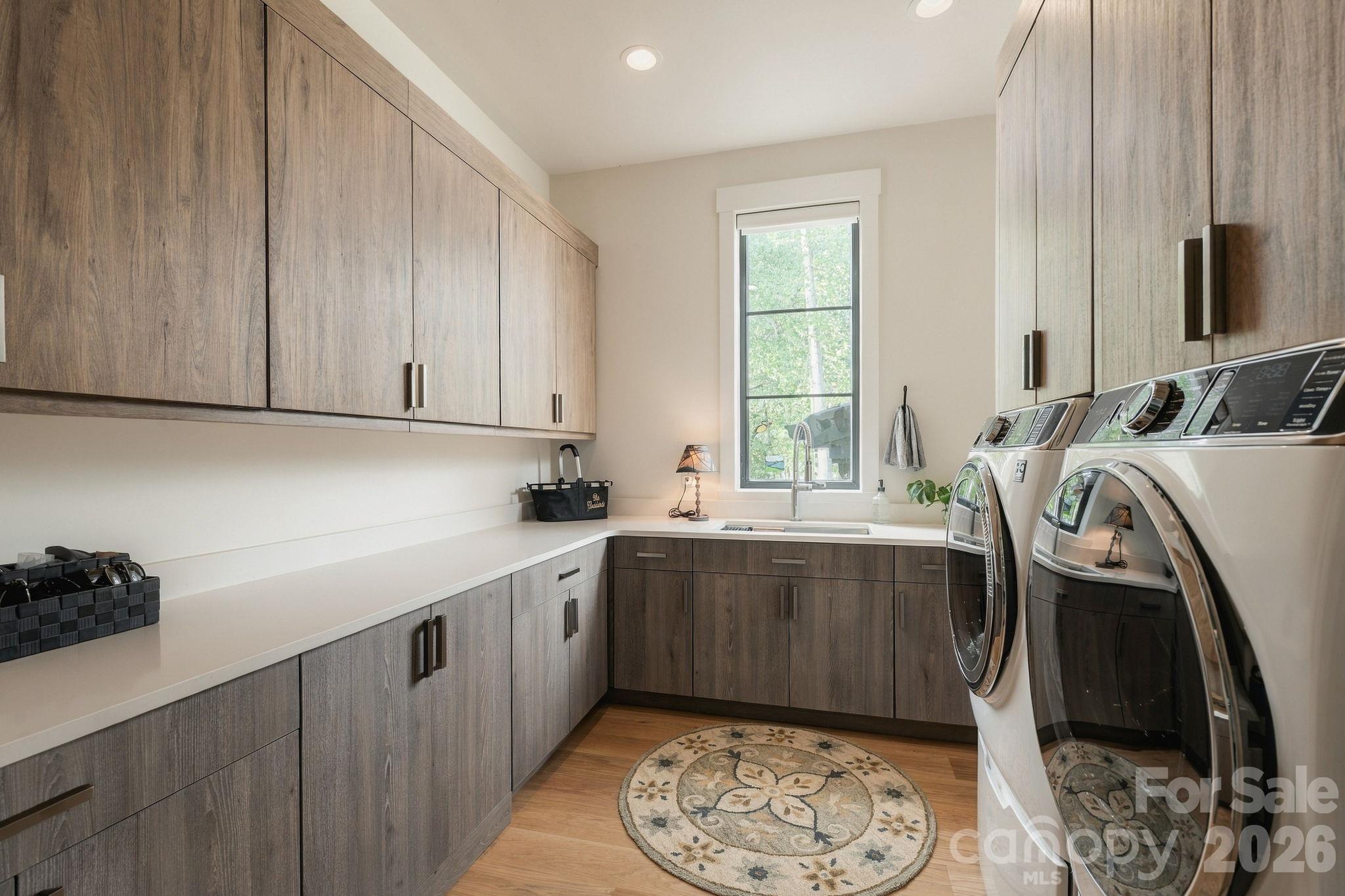 Laundry Room with ample cabinetry - 298 Marietta Road, Mooresville