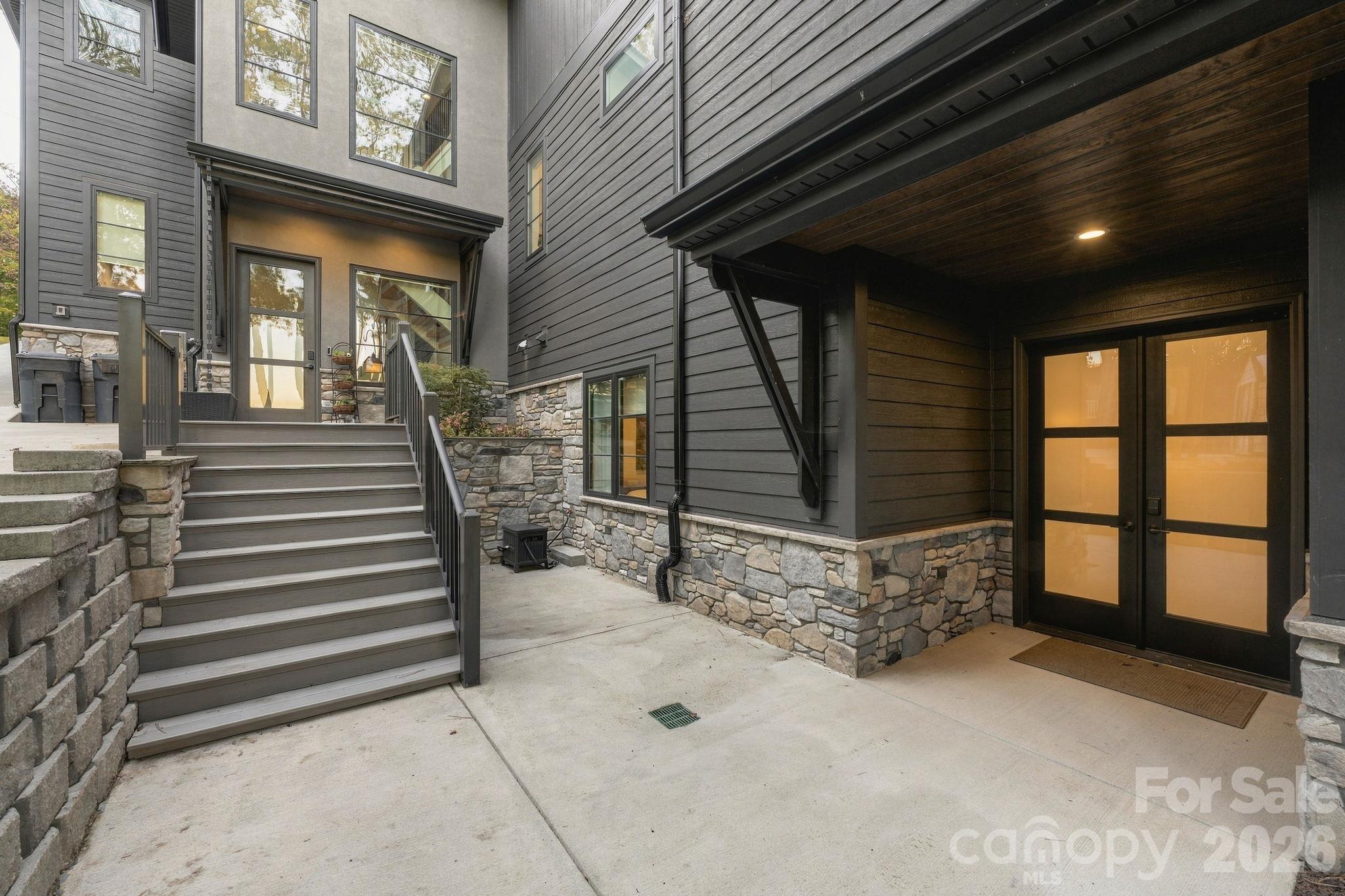 Exterior entry of the separate guest quarters, as well as a walk up to the stair tower which can access all three levels - 298 Marietta Road, Mooresville