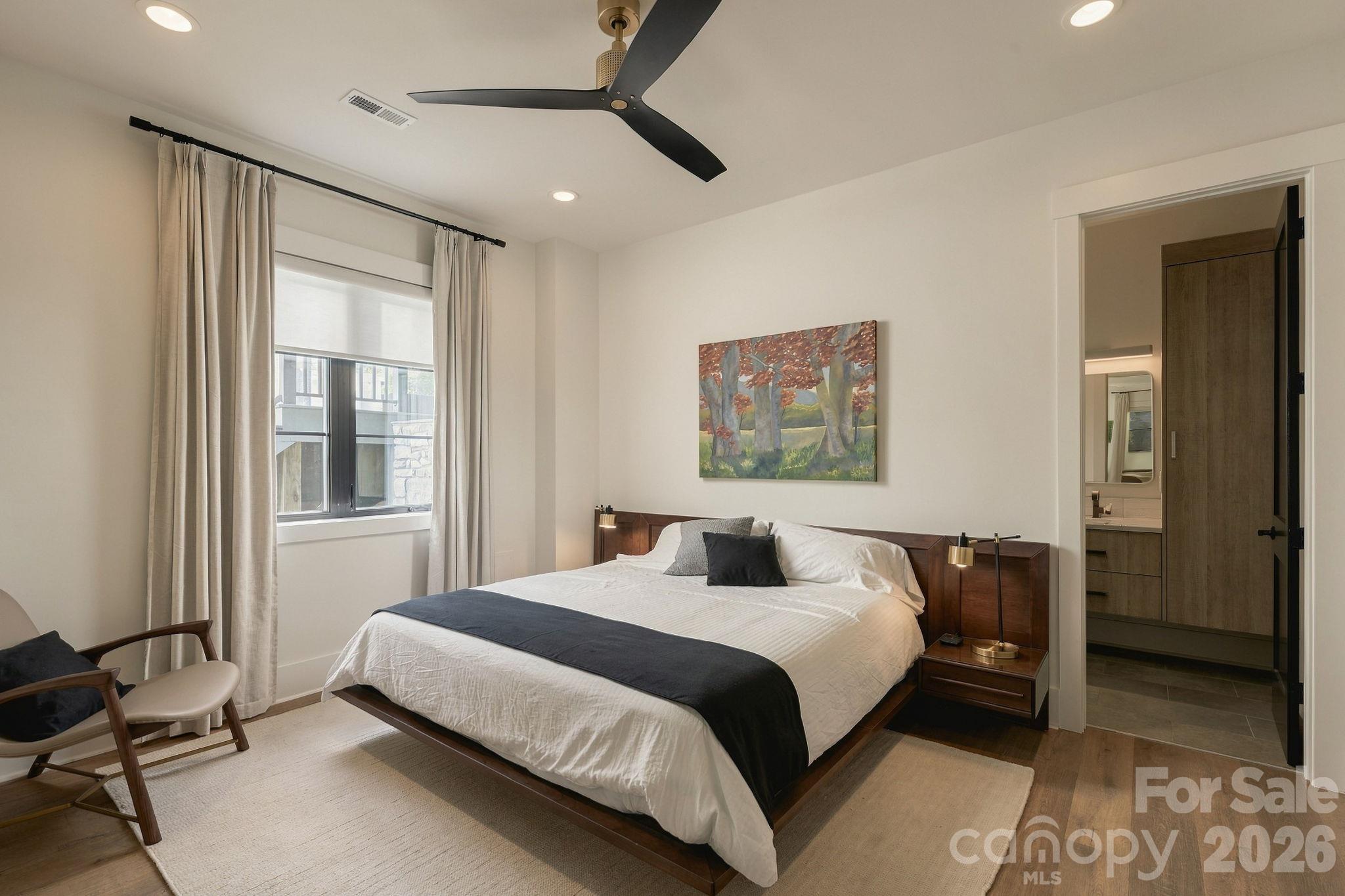 Primary Bedroom on the lower level, complete with ensuite bathroom - 298 Marietta Road, Mooresville