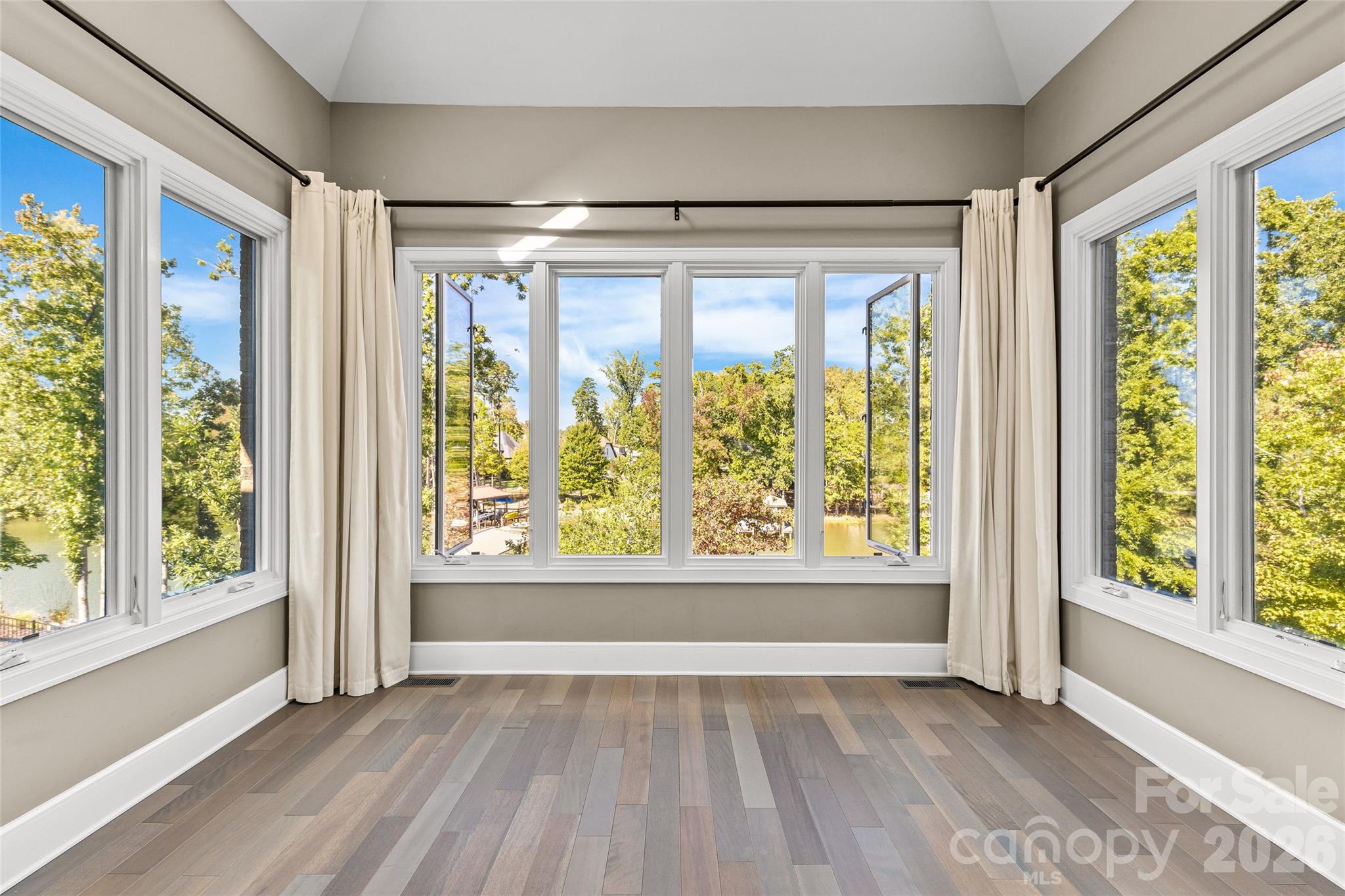 Primary suite with incredible lake views. - 6032 Headlands Court, Belmont