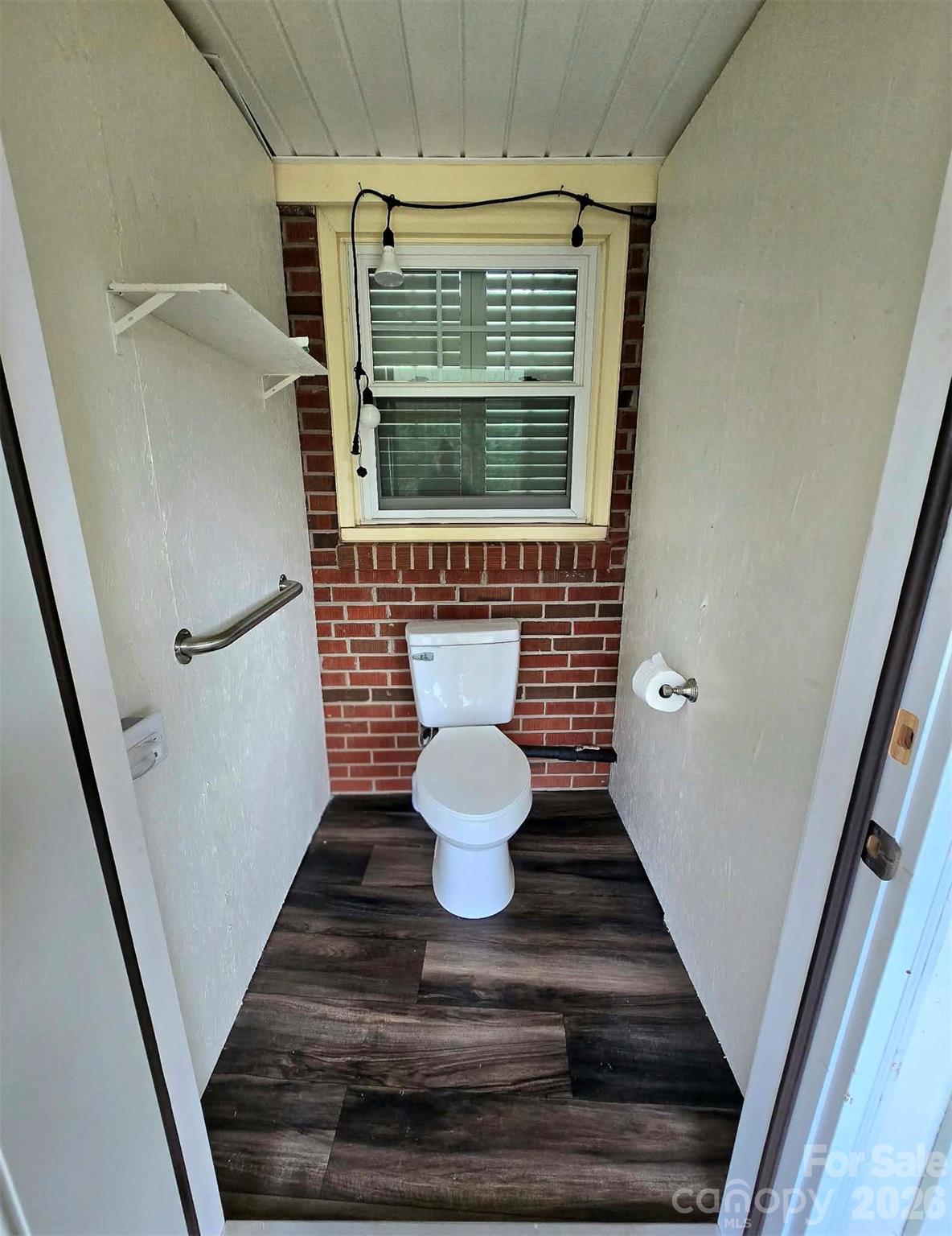 Half Bathroom built onto the screen back deck. - 4107 Windwood Drive, Gastonia