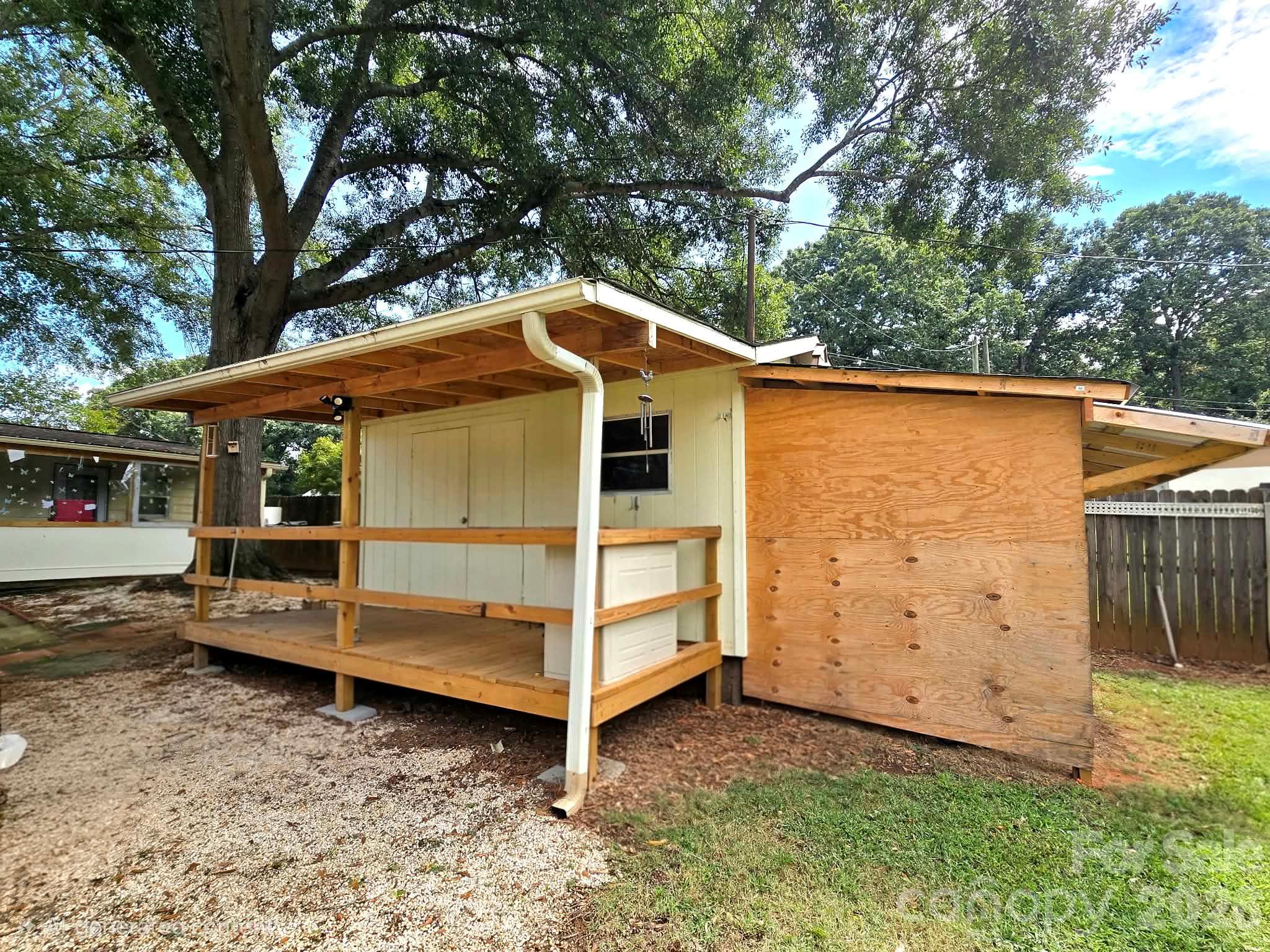 Storage building with a covered porch and lean-to addition - 4107 Windwood Drive, Gastonia