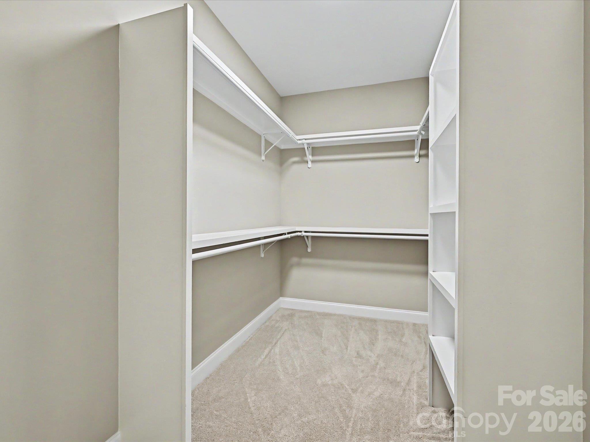 Spacious walk in closet provides abundant storage with built in shelving & convenient dual hanging space. - 159 Lone Pine Road, Statesville