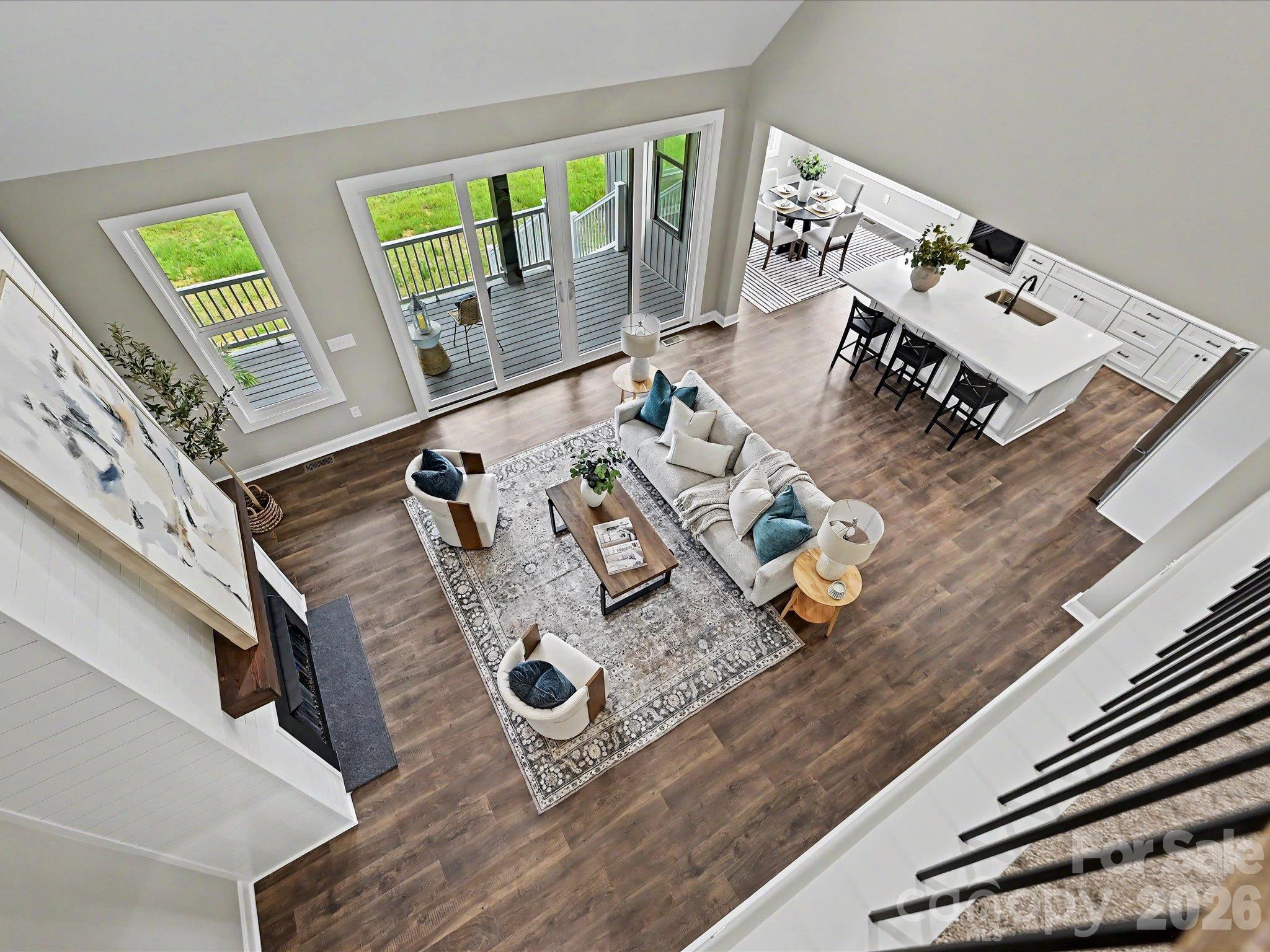 Open to below design showcases the expansive great room, flowing layout & stunning views of the covered outdoor living spaces. - 159 Lone Pine Road, Statesville