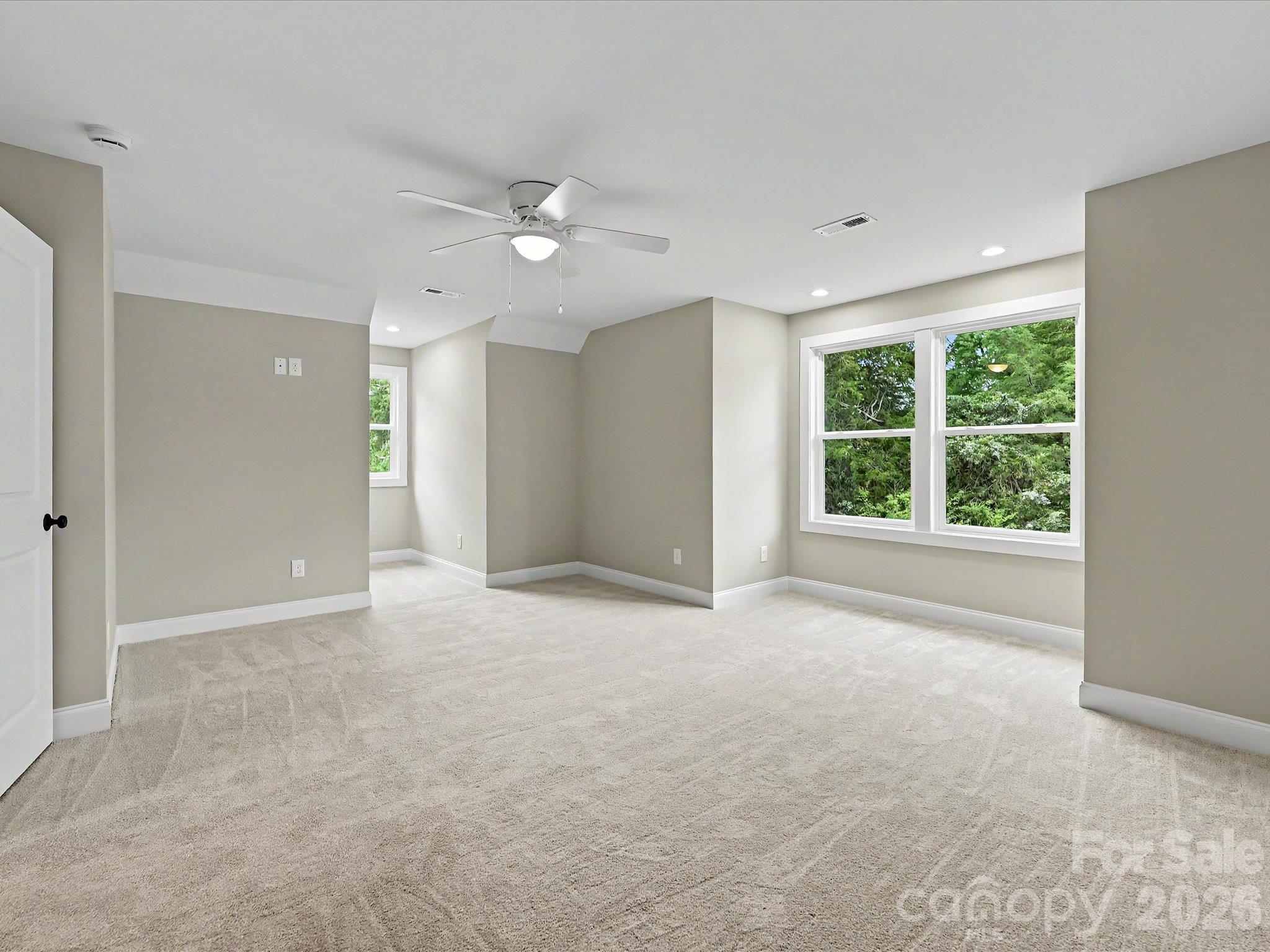 Spacious secondary bedroom on upper level offers plush carpeting, plenty of natural light & flexible space for guests, hobbies or a home office. - 159 Lone Pine Road, Statesville