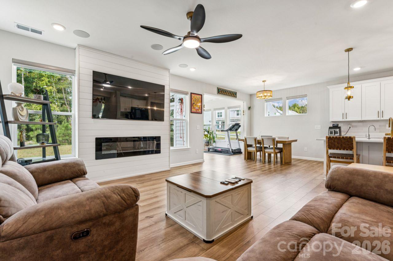 Open living dining and kitchen with sunroom to the side - 8704 Frank Grier Road, Charlotte