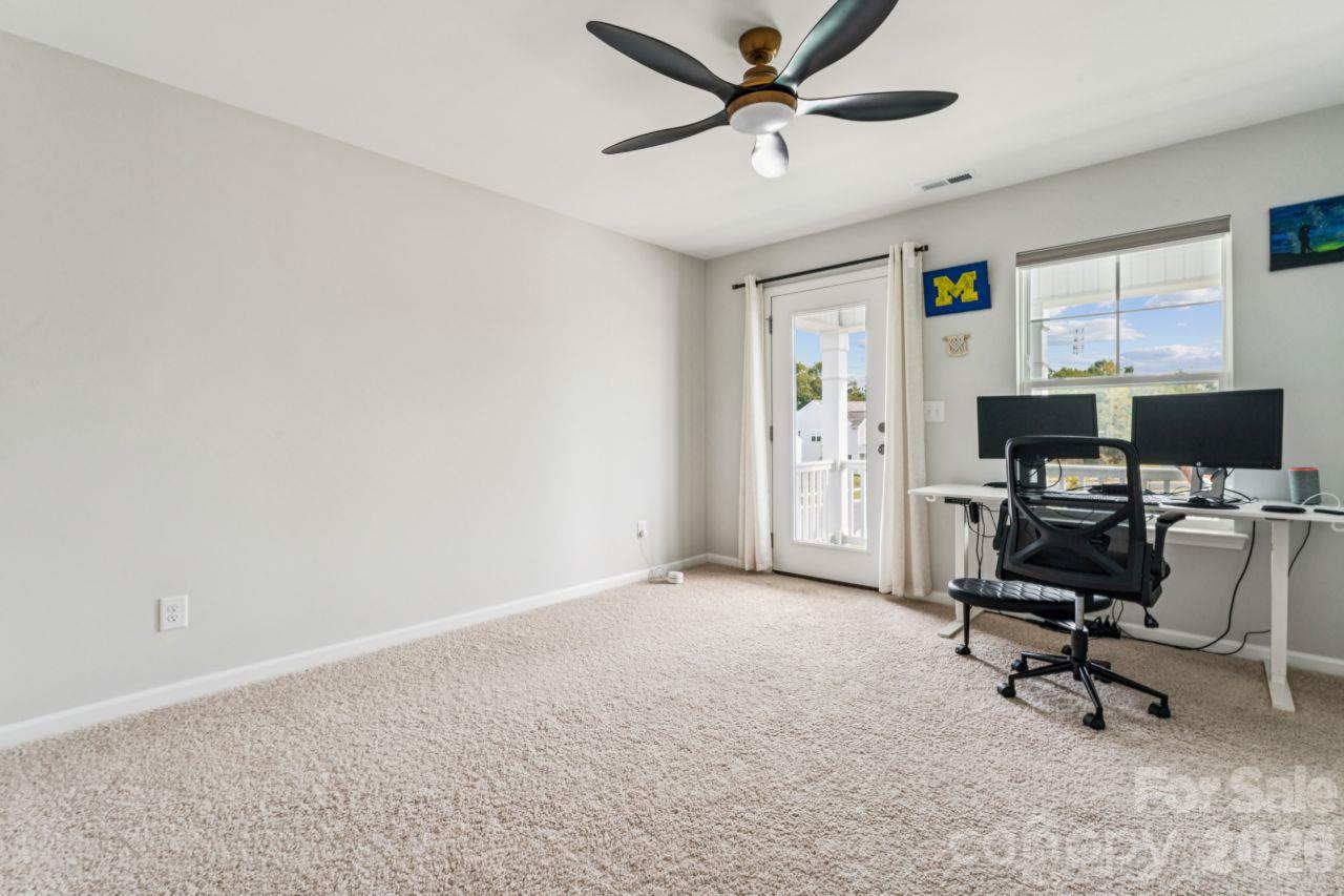 Bedroom 4 with private balcony - 8704 Frank Grier Road, Charlotte