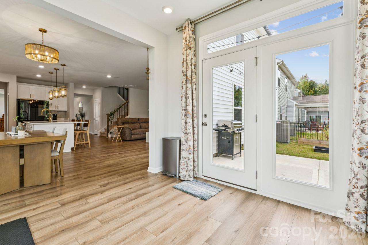 Sunroom with door to back patio - 8704 Frank Grier Road, Charlotte
