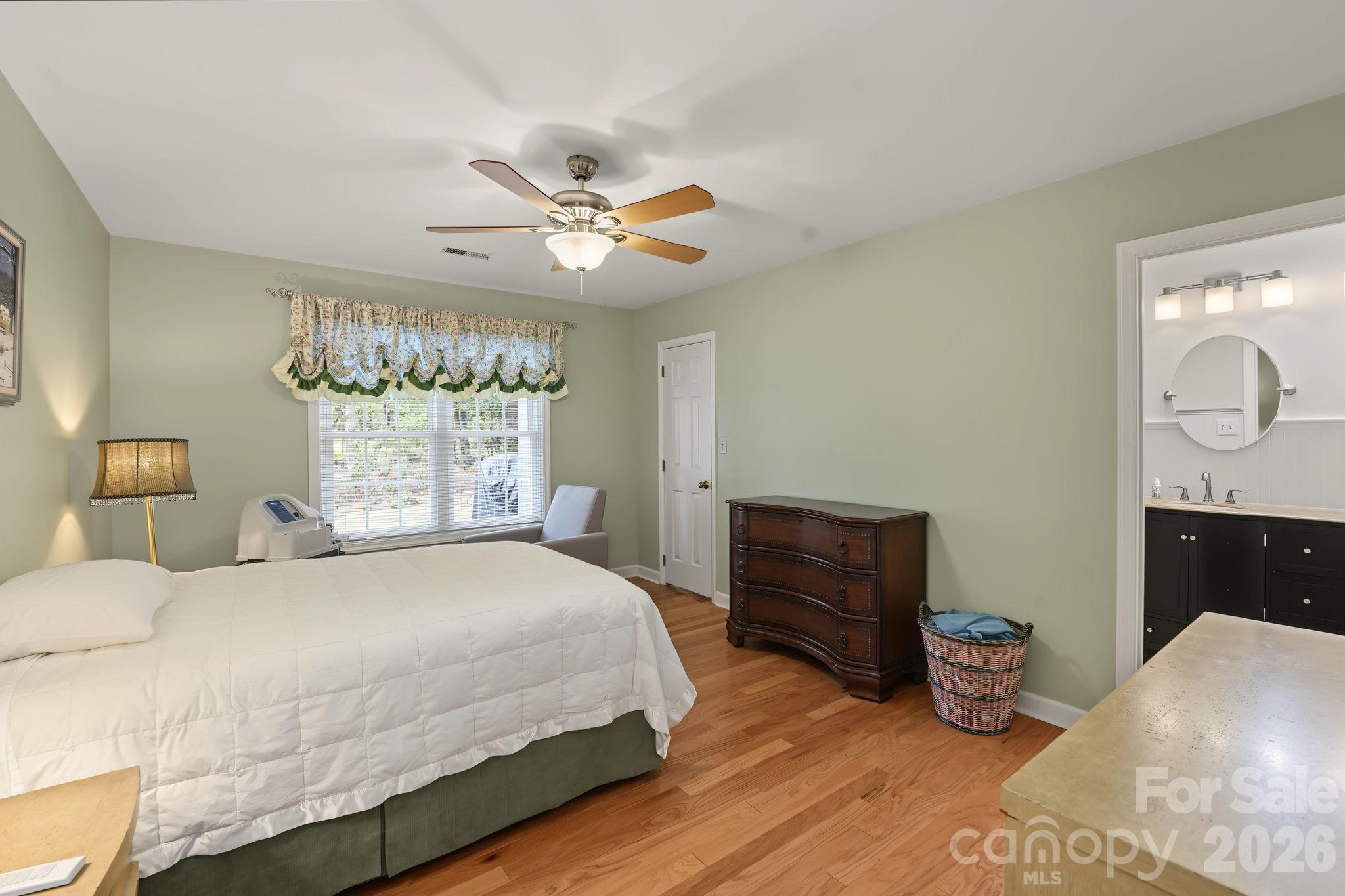 Primary bedroom with view into ensuite - 420 English Ivy Court, Fort Mill