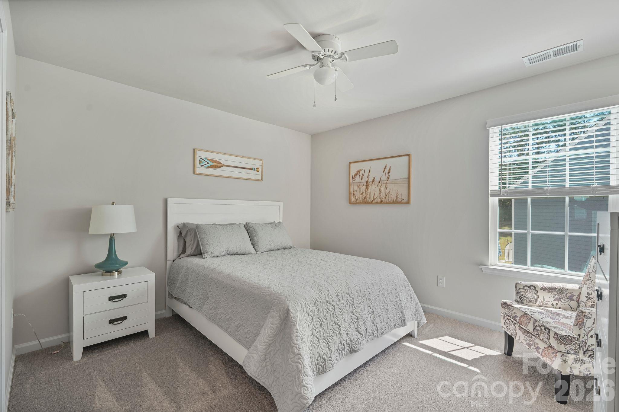Third upstairs bedroom offering comfortable living space and versatility. - 107 Hollywood Court, Troutman