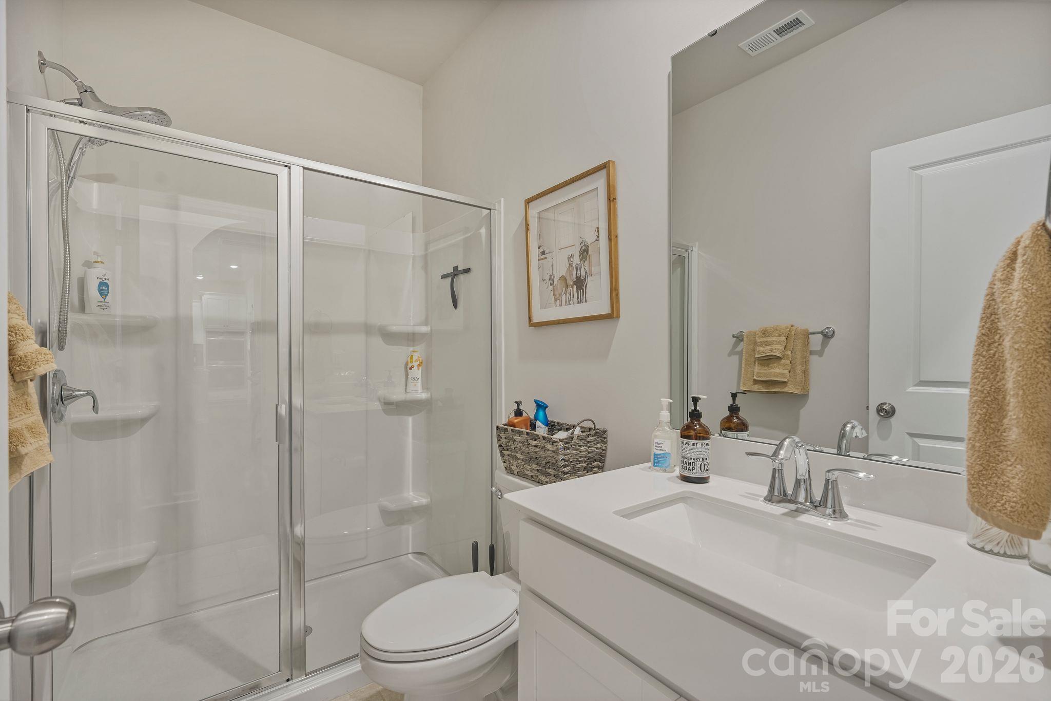 Conveniently located main-level full bathroom serving the first-floor bedroom and additional living areas. - 107 Hollywood Court, Troutman