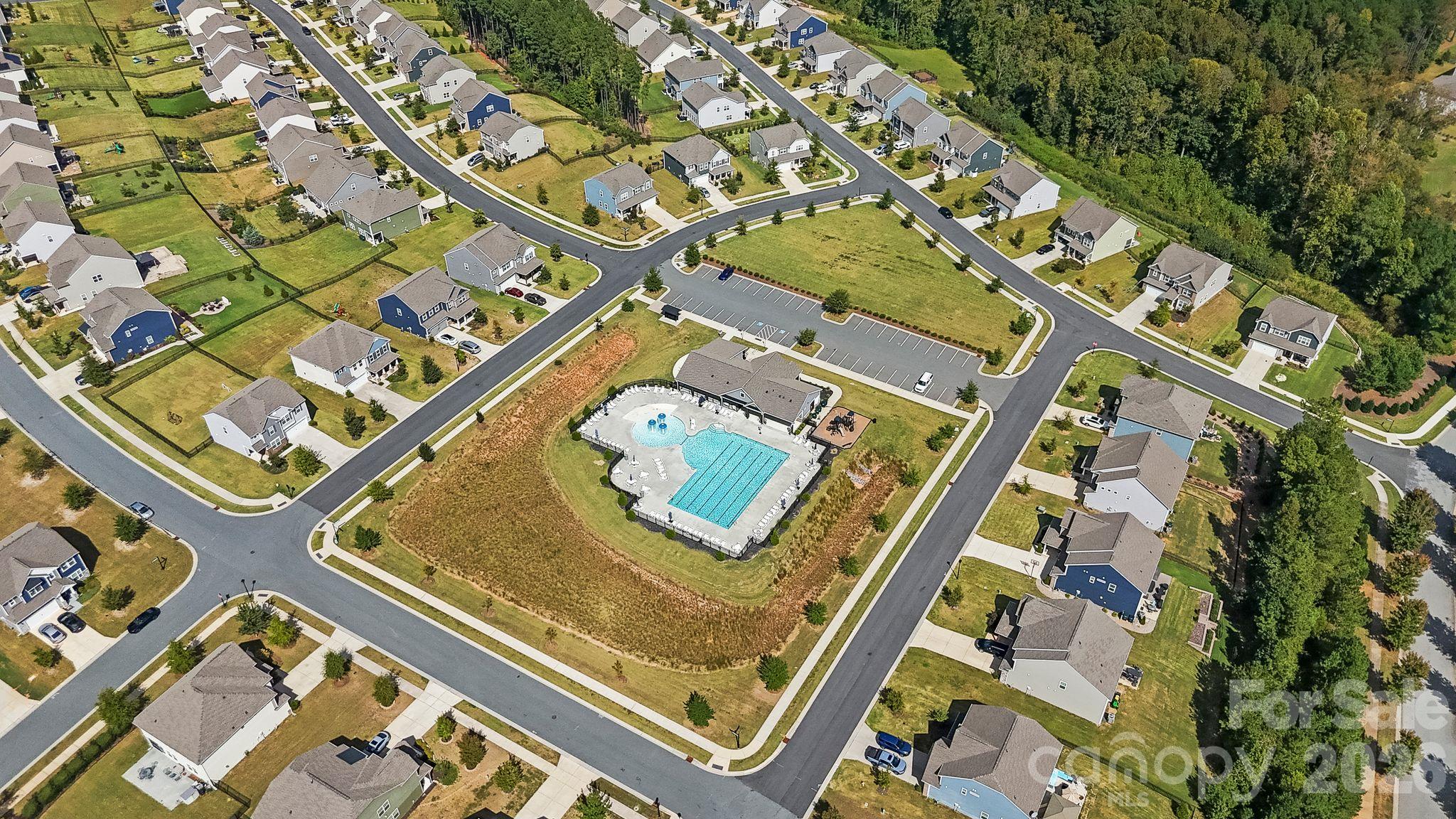 Enjoy exceptional community amenities, including a swimming pool, clubhouse, dog park, playground, and lighted sidewalks. - 107 Hollywood Court, Troutman