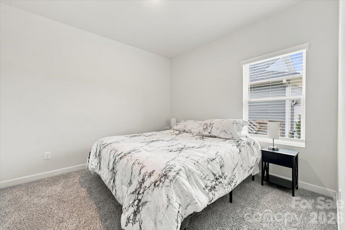2nd bedroom with neutral paint & flooring. - 7722 Porrera Street, Charlotte