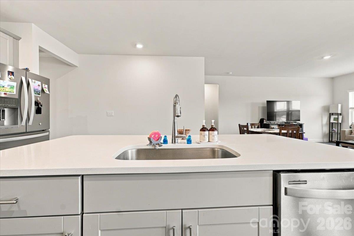 Large island with one bowl sink & dishwasher. - 7722 Porrera Street, Charlotte