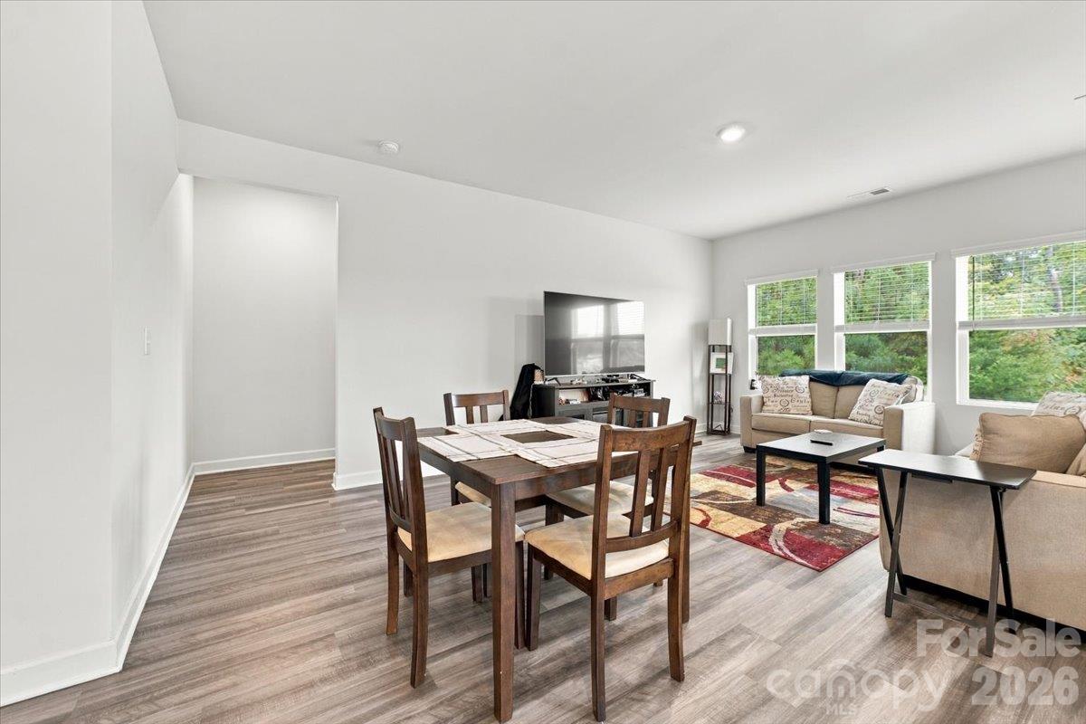 Living room is open to the kitchen & dining for entertaining ease. - 7722 Porrera Street, Charlotte
