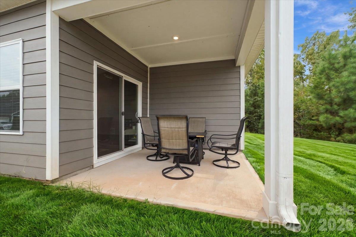 Covered patio off the rear of the home. - 7722 Porrera Street, Charlotte
