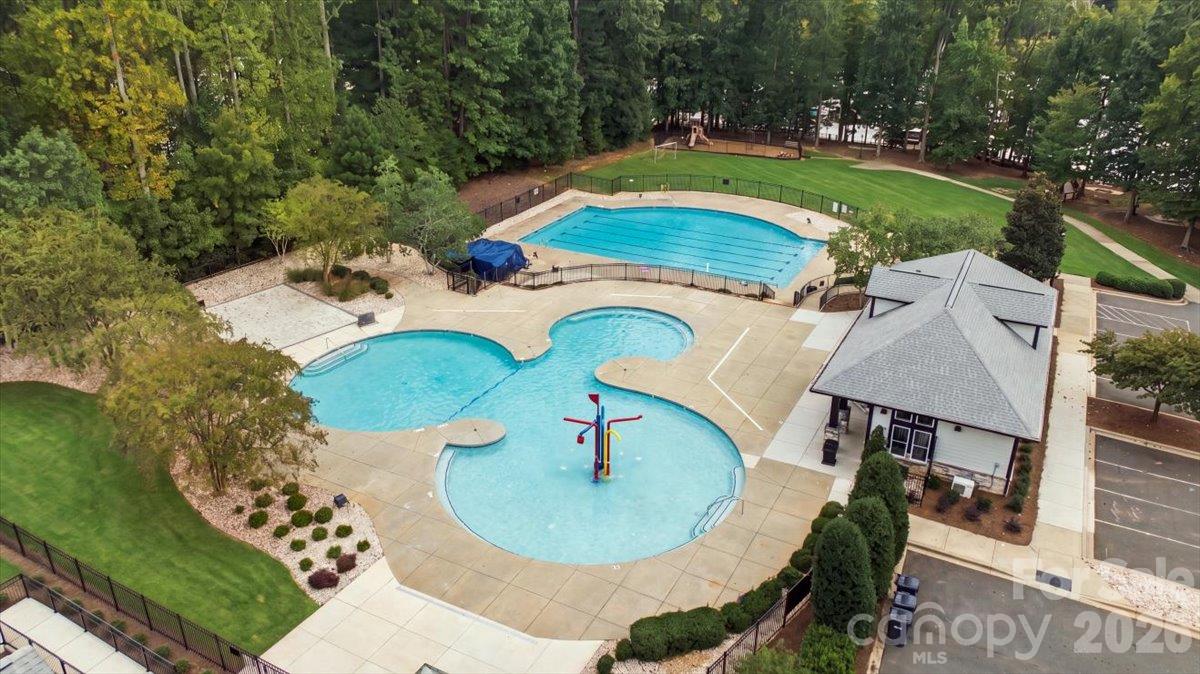 Large outdoor pool located in the gated amenity area. - 7722 Porrera Street, Charlotte