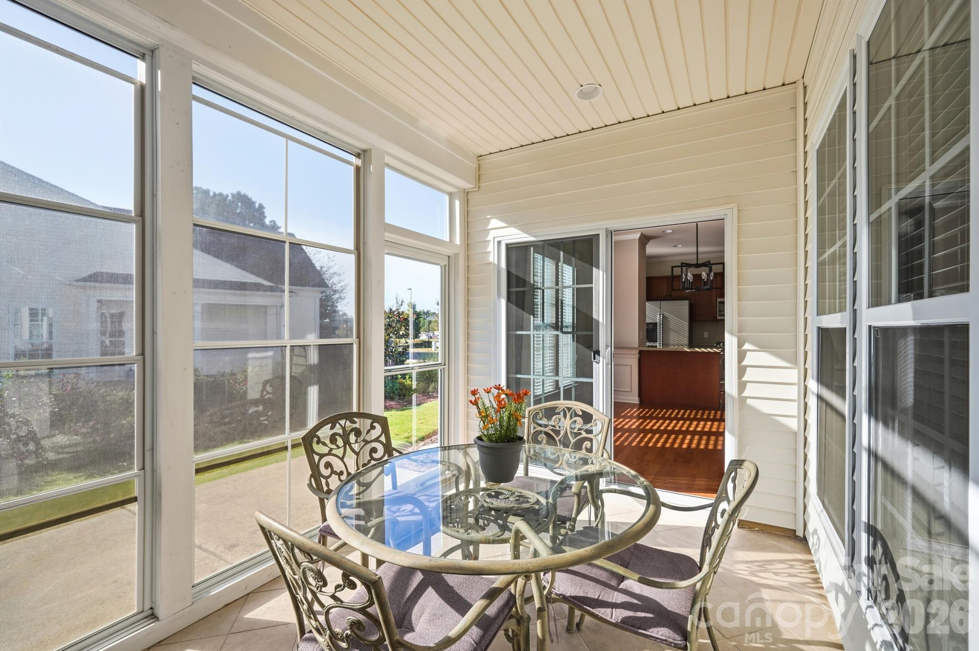 3-Season Room is screened and has Eze-Breeze type nesting vinyl window panels to keep you warm. - 2047 Sweetleaf Drive, Indian Land