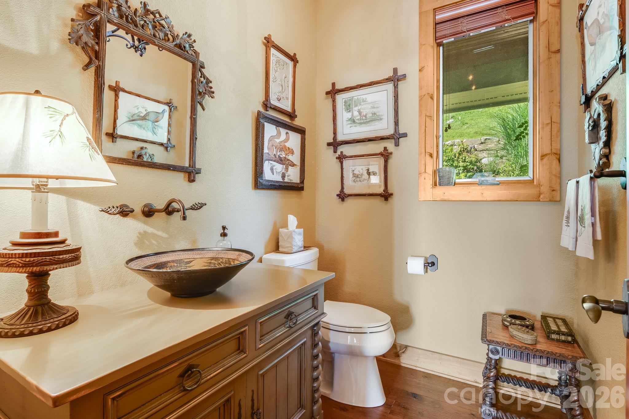 Main level guest half bath. - 179 Cherry Knob Drive, Mars Hill