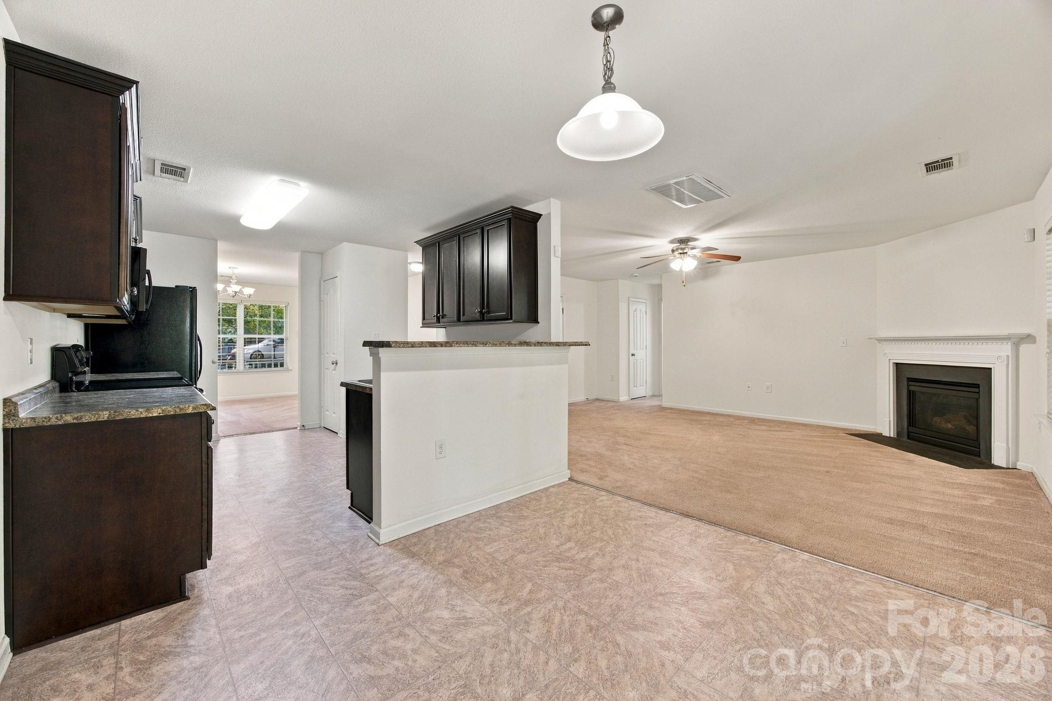 View of the family room kitchen and dining area - 11604 Ragan Elizabeth Court, Charlotte