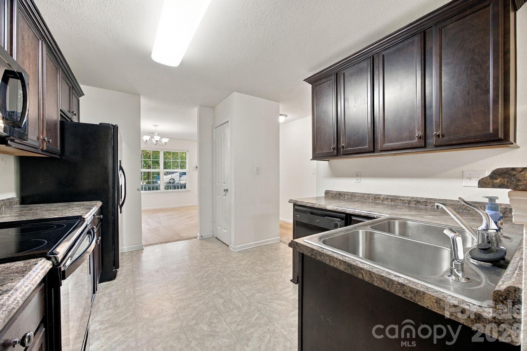 kitchen looking into the flex space - 11604 Ragan Elizabeth Court, Charlotte