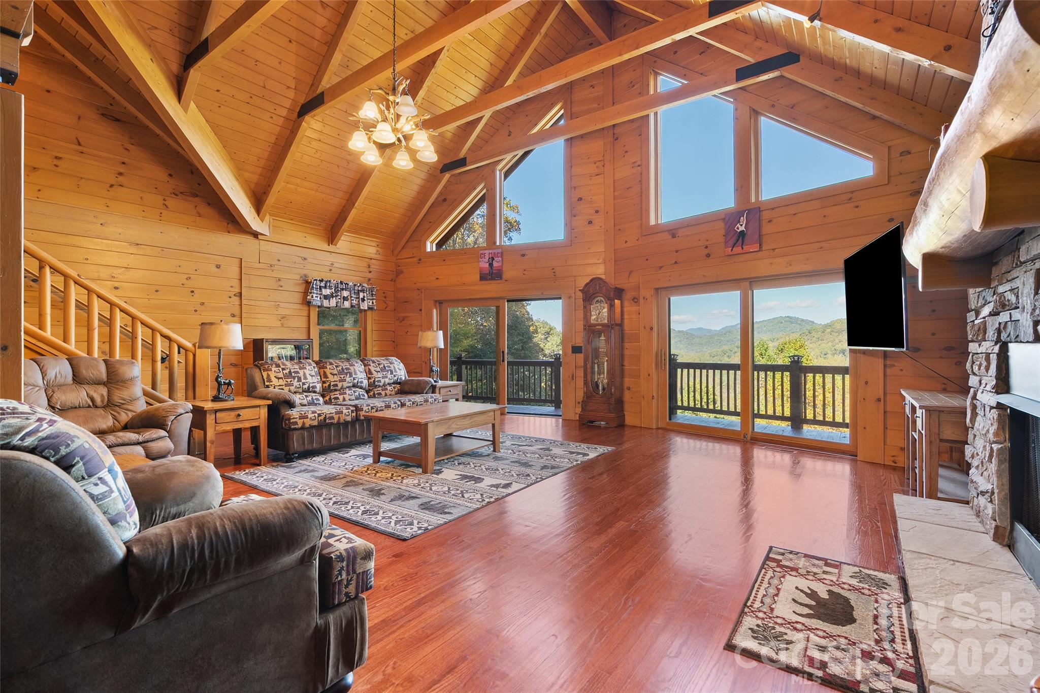 Dramatic vaulted ceilings and oversized windows frame the mountain scenery. - 124 Borges Lane, Waynesville