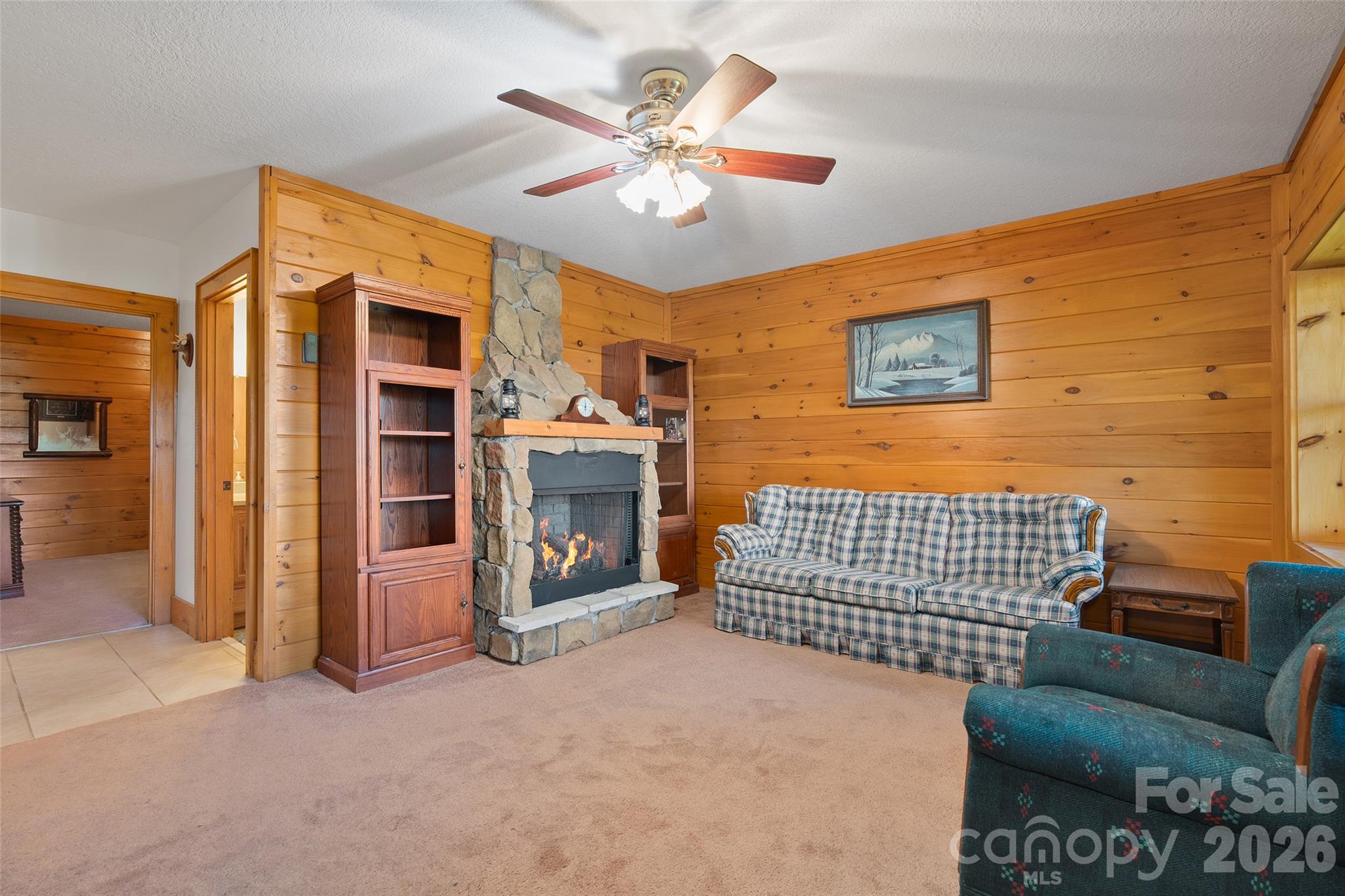Comfortable family room with fireplace and room to relax. - 124 Borges Lane, Waynesville