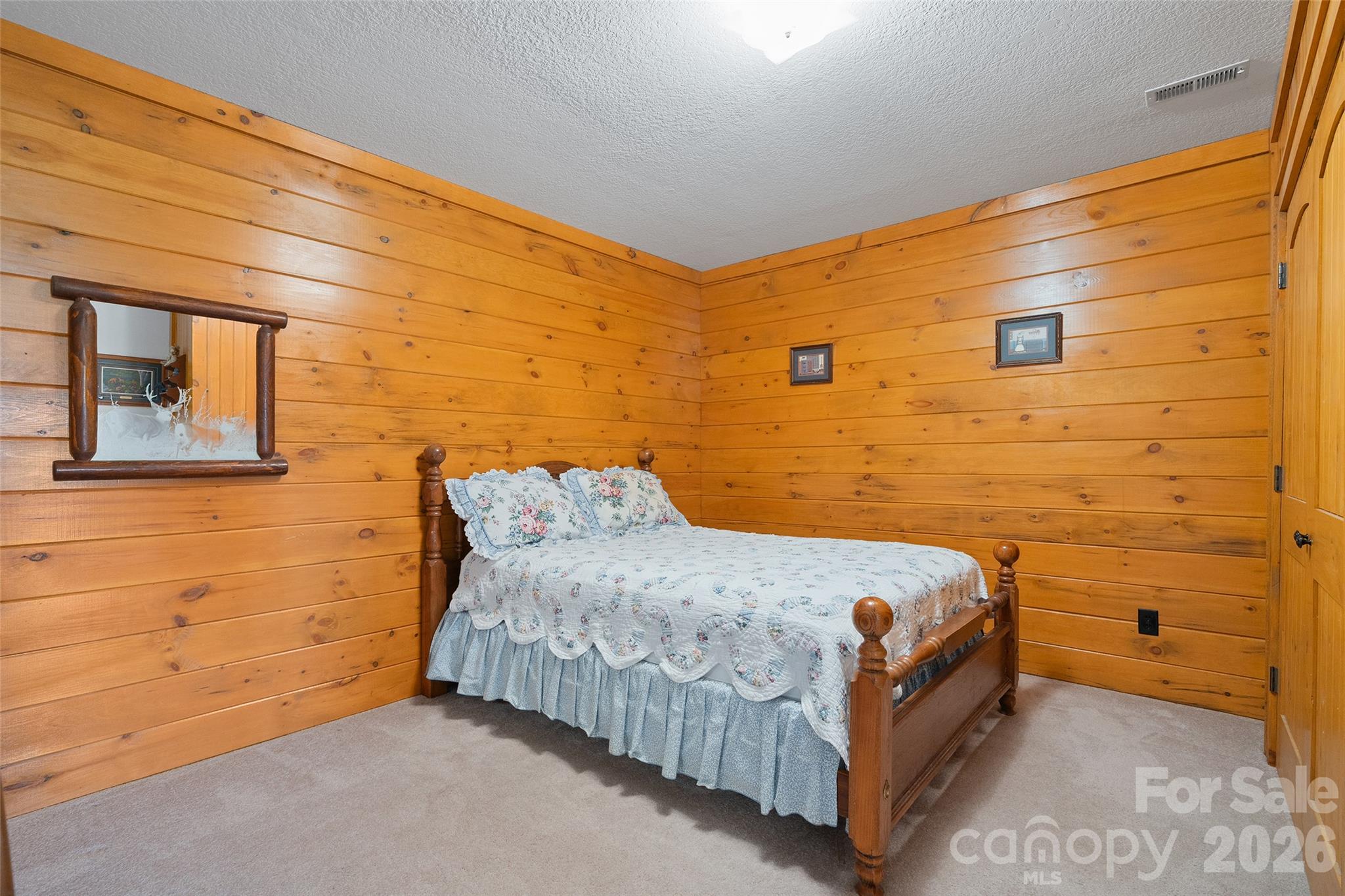 Spacious lower-level bonus room with warm wood finishes. - 124 Borges Lane, Waynesville