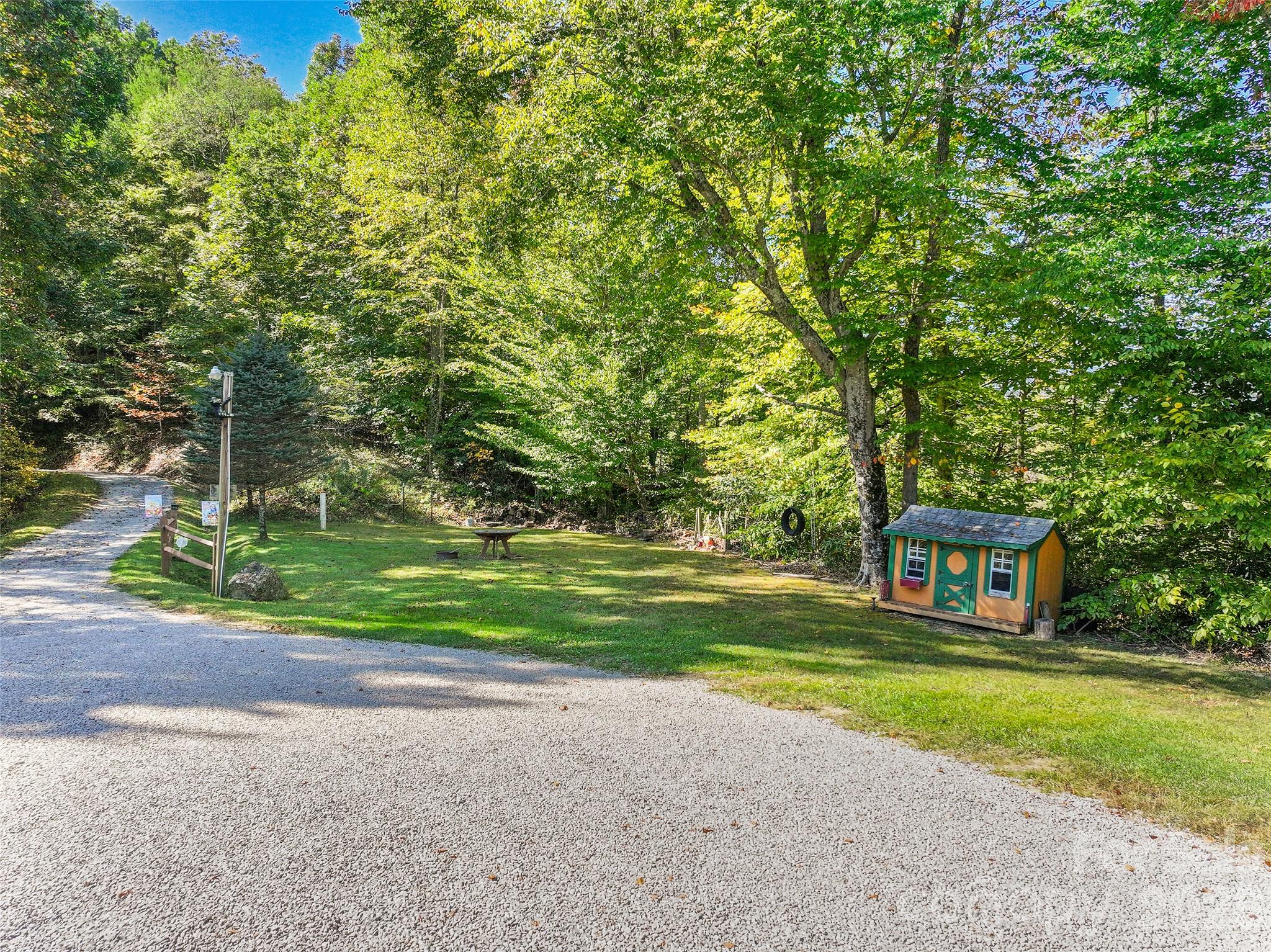 Spacious driveway and natural surroundings welcome you home. - 124 Borges Lane, Waynesville