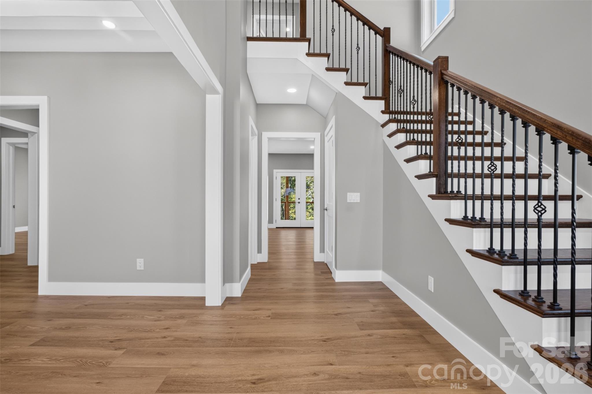 This grand staircase and open foyer draws you in to see more. - 160 Pumice Drive, Statesville