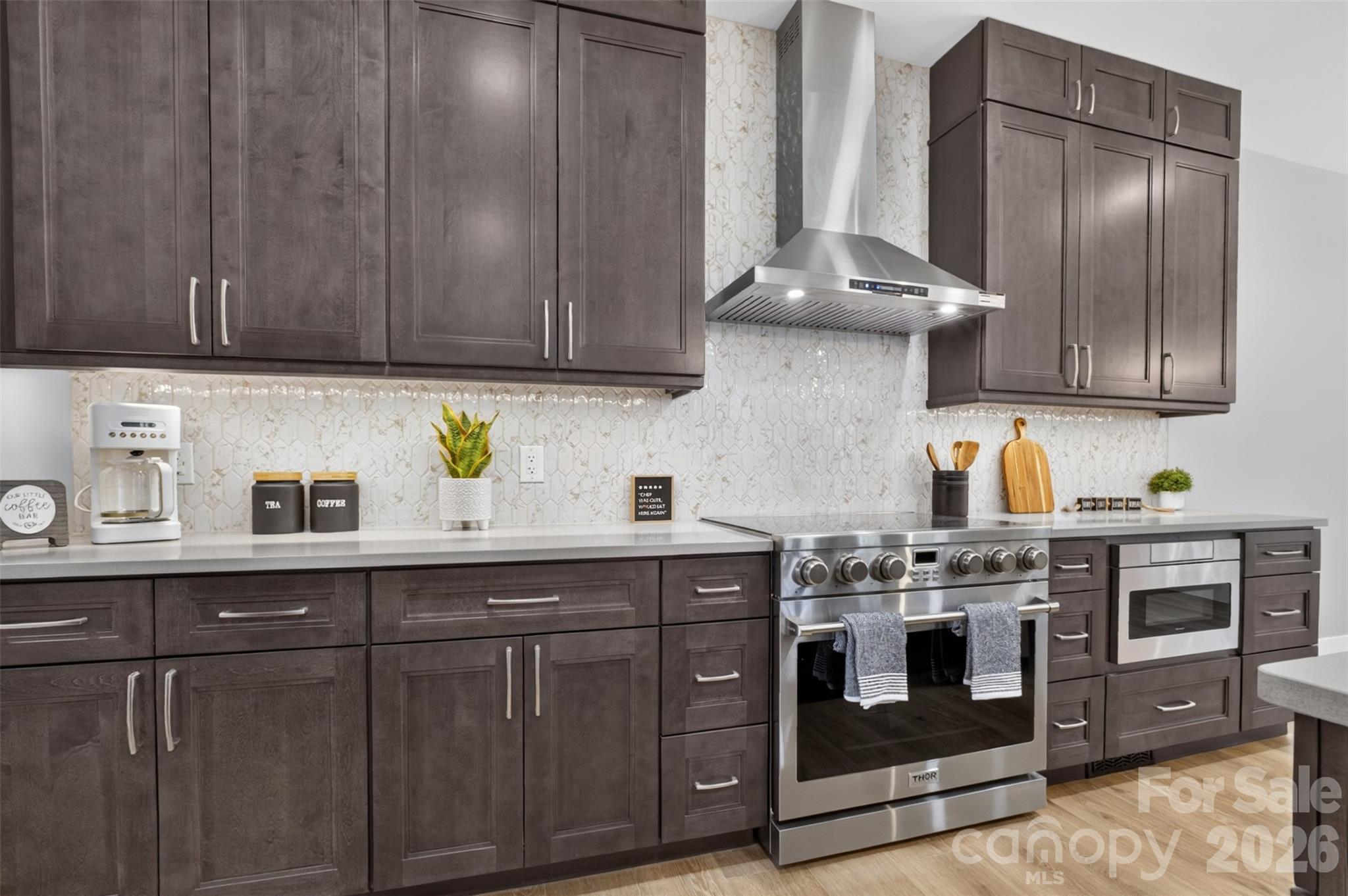 The kitchen features soft close cabinets and quartz countertops. - 160 Pumice Drive, Statesville
